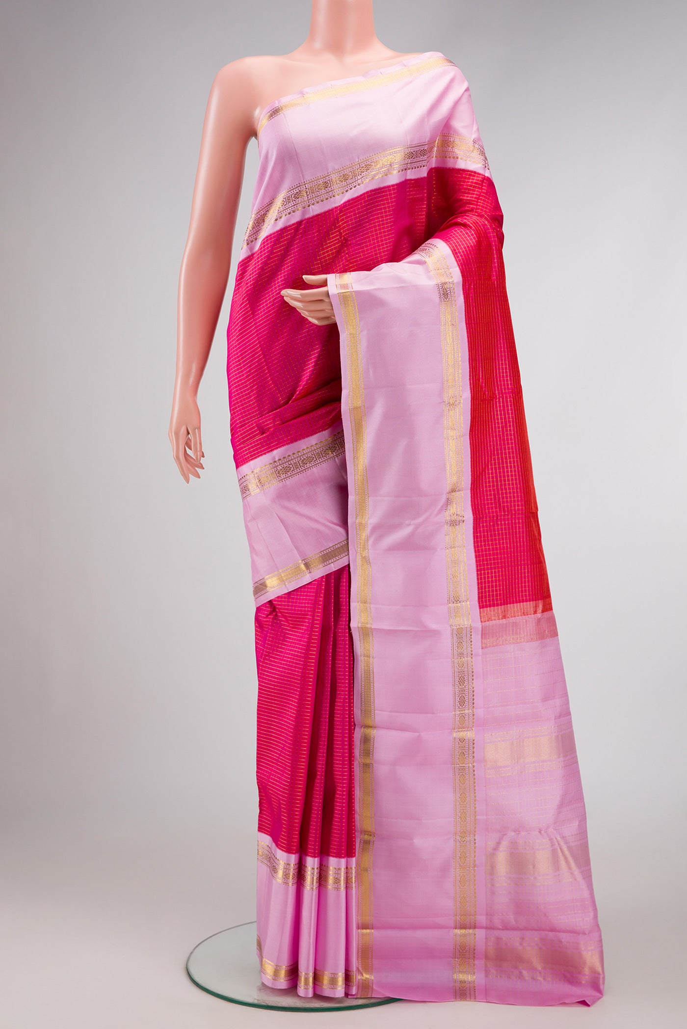Pink Dual Tone Kanjivaram Silk Saree with Checked design on the body and Zari Border.  displayed on a mannequin