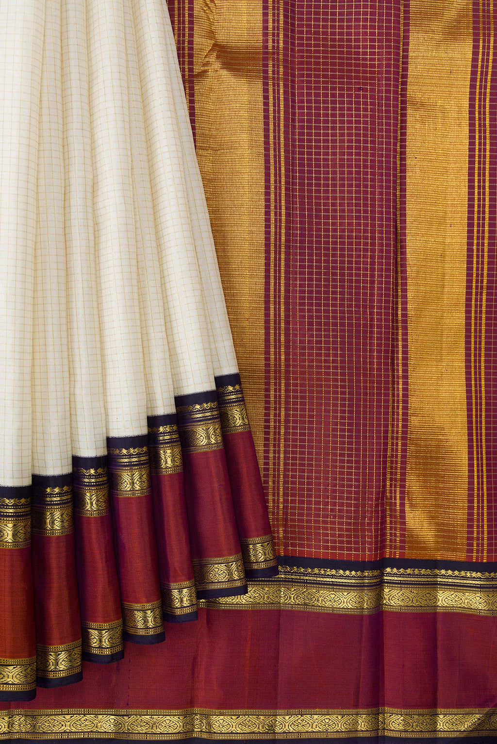 Pleats and pallu of Off White Dual Tone Kanjivaram Silk Saree with Checked design on the body and Zari Border. 