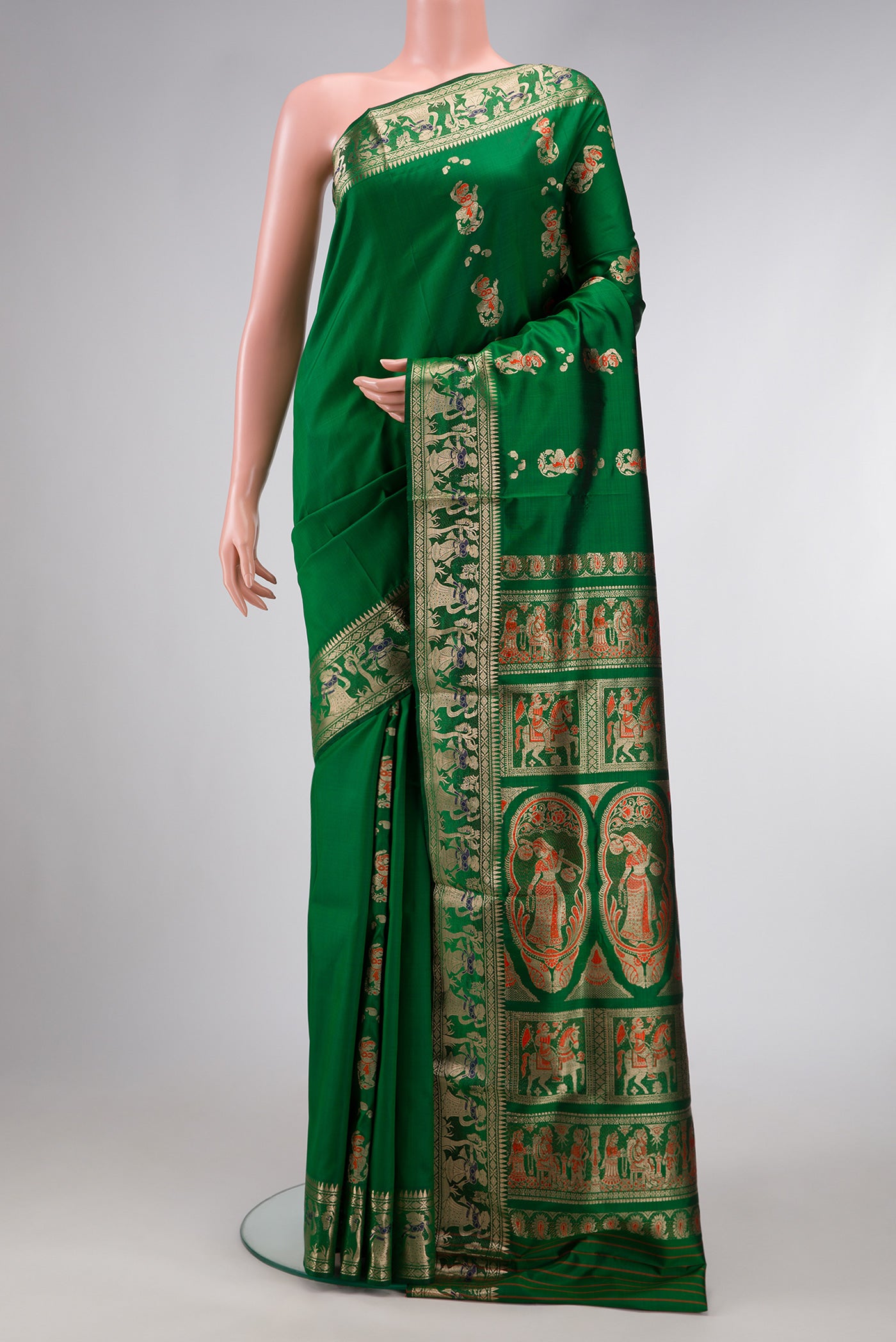 Green Dual Tone Baluchari Silk Saree with Zari And Thread Butta on the body and Thread Border.  displayed on a mannequin
