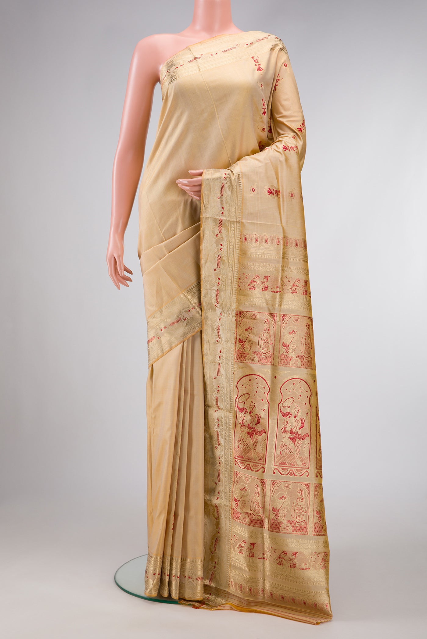 Beige Dual Tone Baluchari Silk Saree with Zari And Thread Butta on the body and Zari Border.  displayed on a mannequin