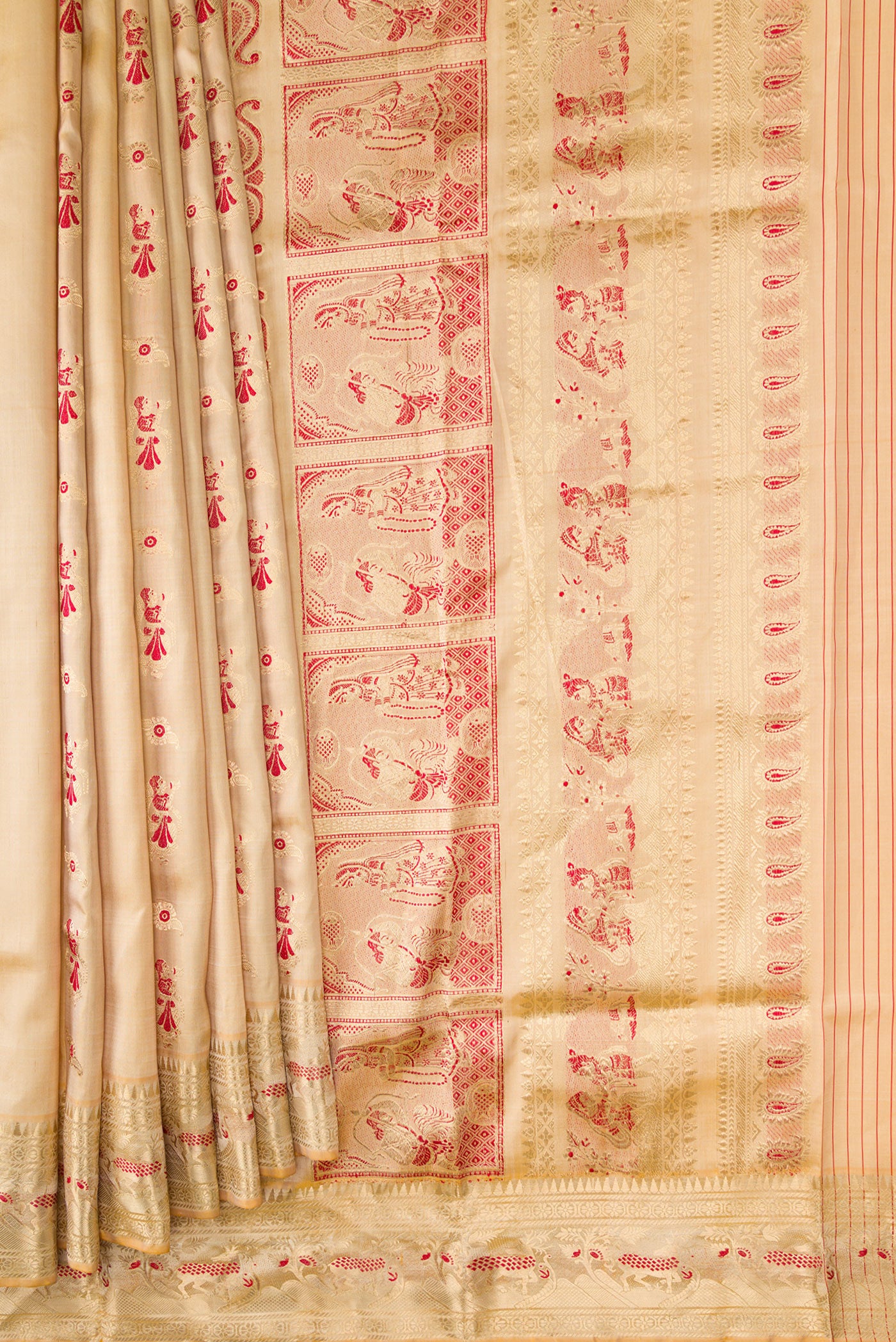 Pleats and pallu of Beige Dual Tone Baluchari Silk Saree with Zari And Thread Butta on the body and Zari Border. 