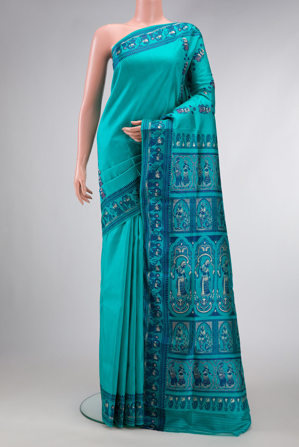 Sky Blue Dual Tone Baluchari Silk Saree with Thread Butta on the body and Thread Border.  displayed on a mannequin