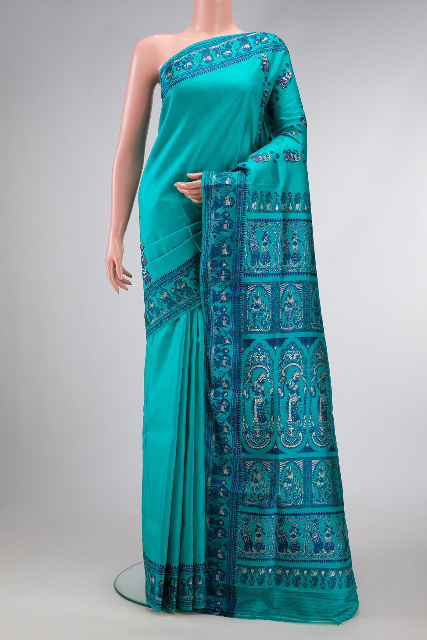 Sky Blue Dual Tone Baluchari Silk Saree with Thread Butta on the body and Thread Border.  displayed on a mannequin