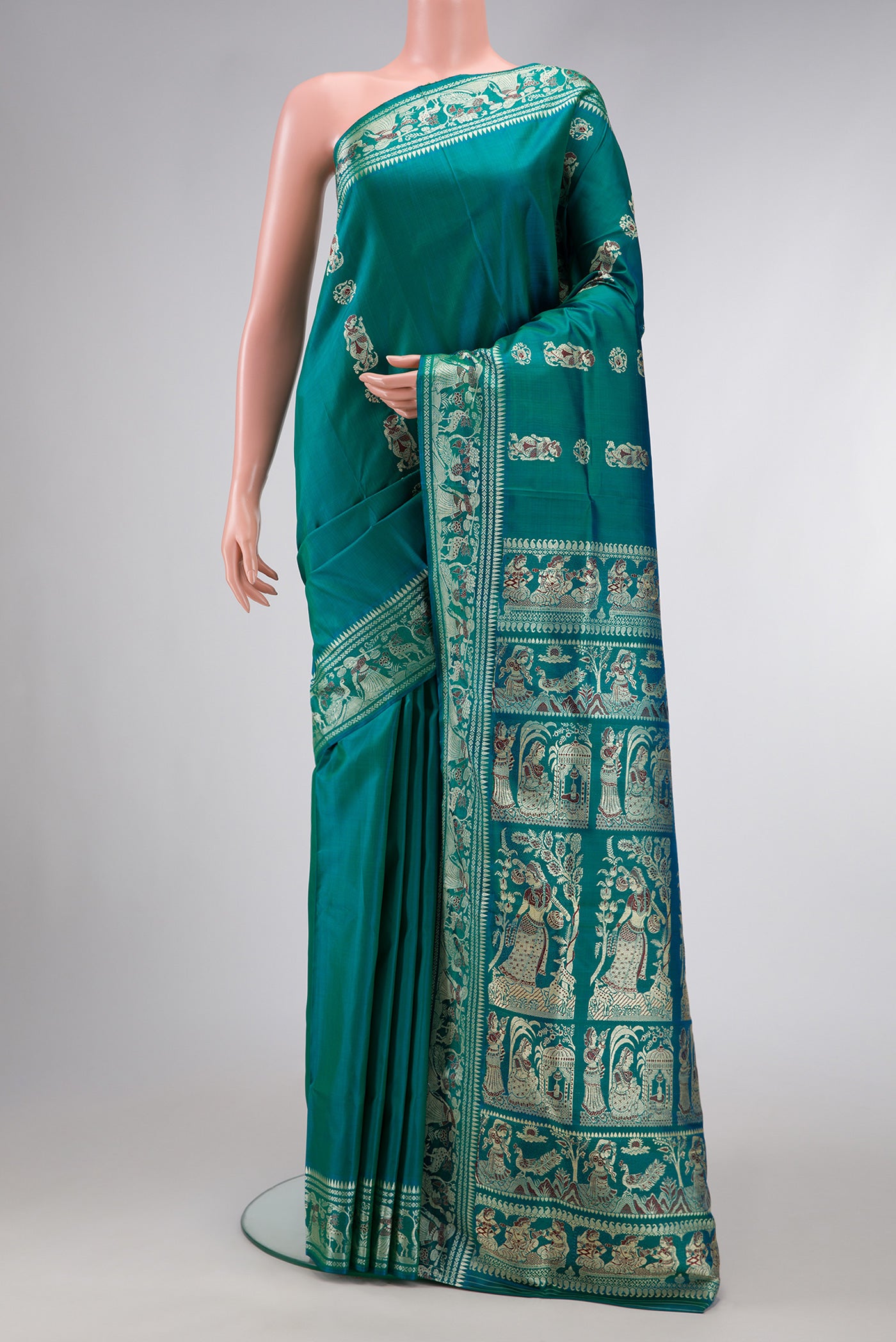 Green Dual Tone Baluchari Silk Saree with Thread Butta on the body and Thread Border.  displayed on a mannequin