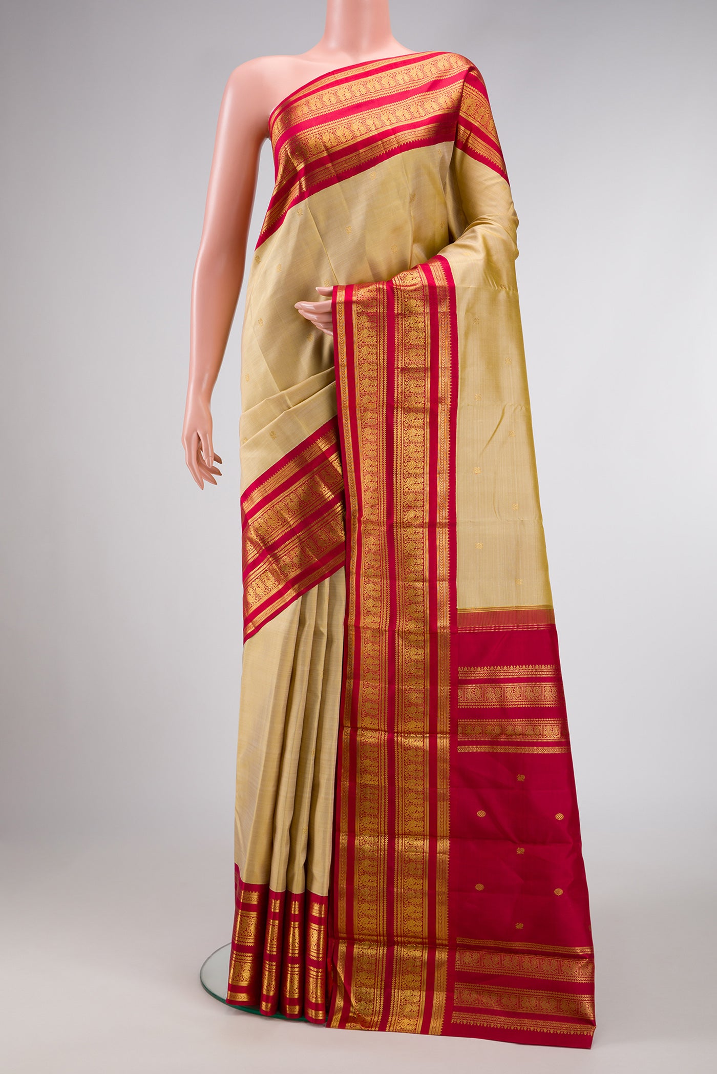 Dark Beige Dual Tone Kanchipuram Silk Saree with Zari Butta on the body and Zari Border.  displayed on a mannequin