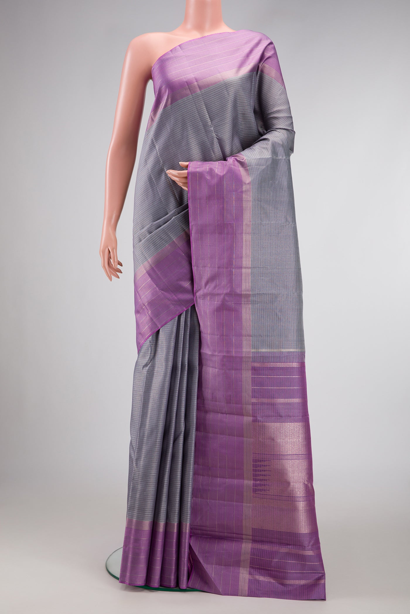Grey Dual Tone Kanjivaram Silk Saree with Zari Butta on the body and Zari Border.  displayed on a mannequin