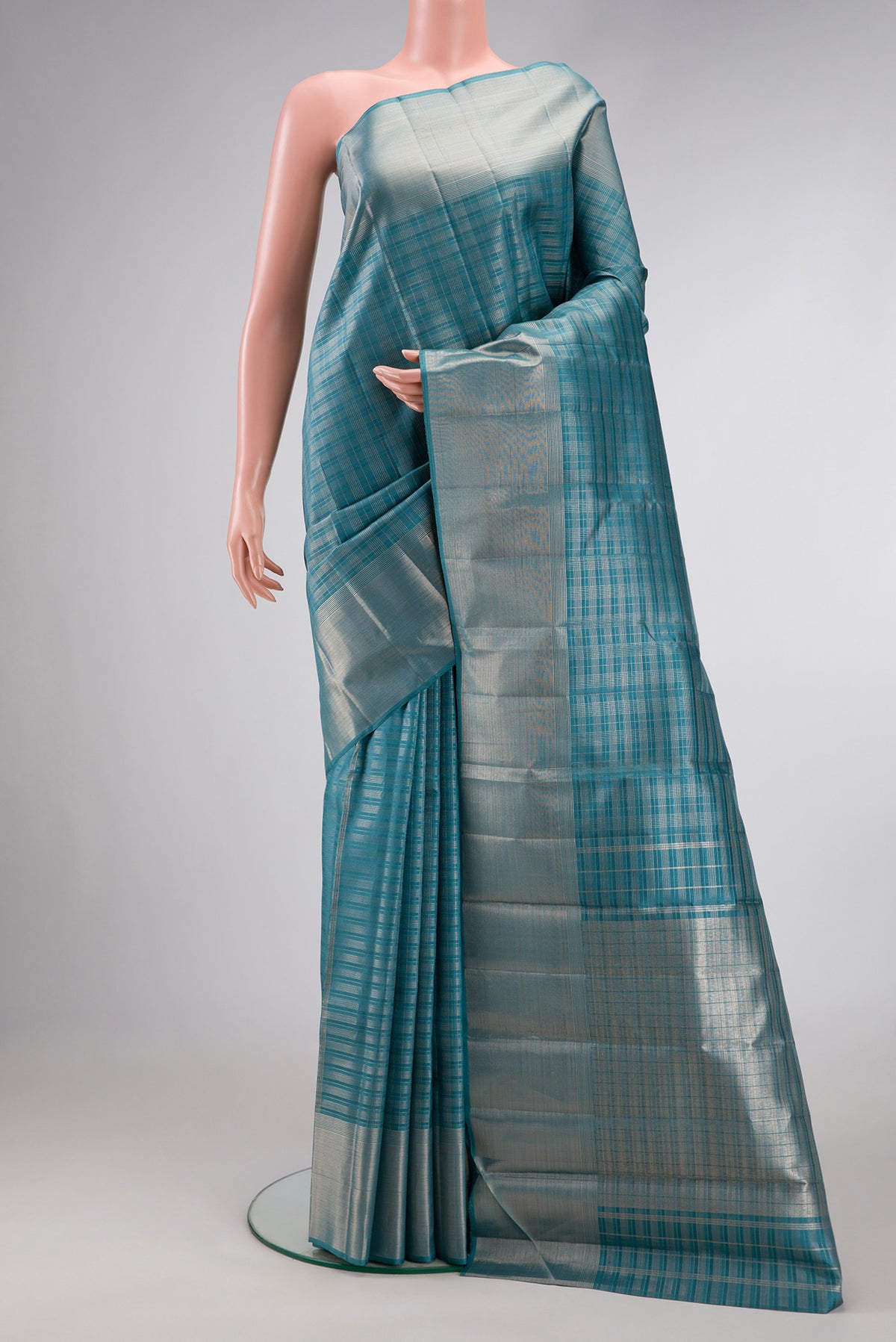 Maya Blue Dual Tone Kanjivaram Silk Saree with Checked design on the body and Zari Border.  displayed on a mannequin