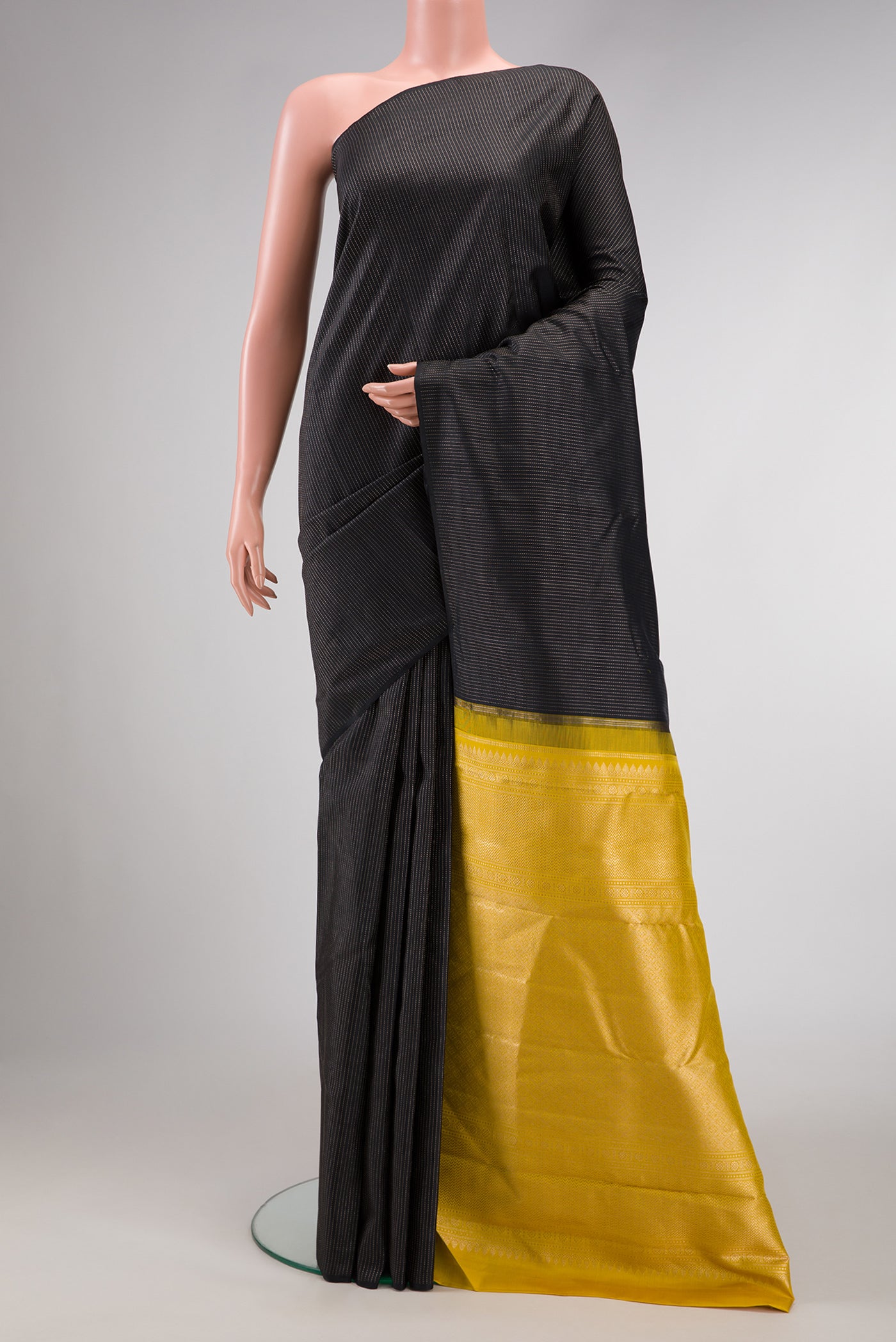 Black Dual Tone Kanjivaram Silk Saree with Stripes on the body and Without Border.  displayed on a mannequin