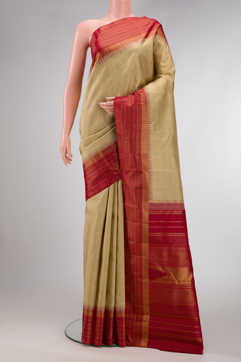 Beige Dual Tone Kanjivaram Silk Saree with Checked design on the body and Zari Border.  displayed on a mannequin