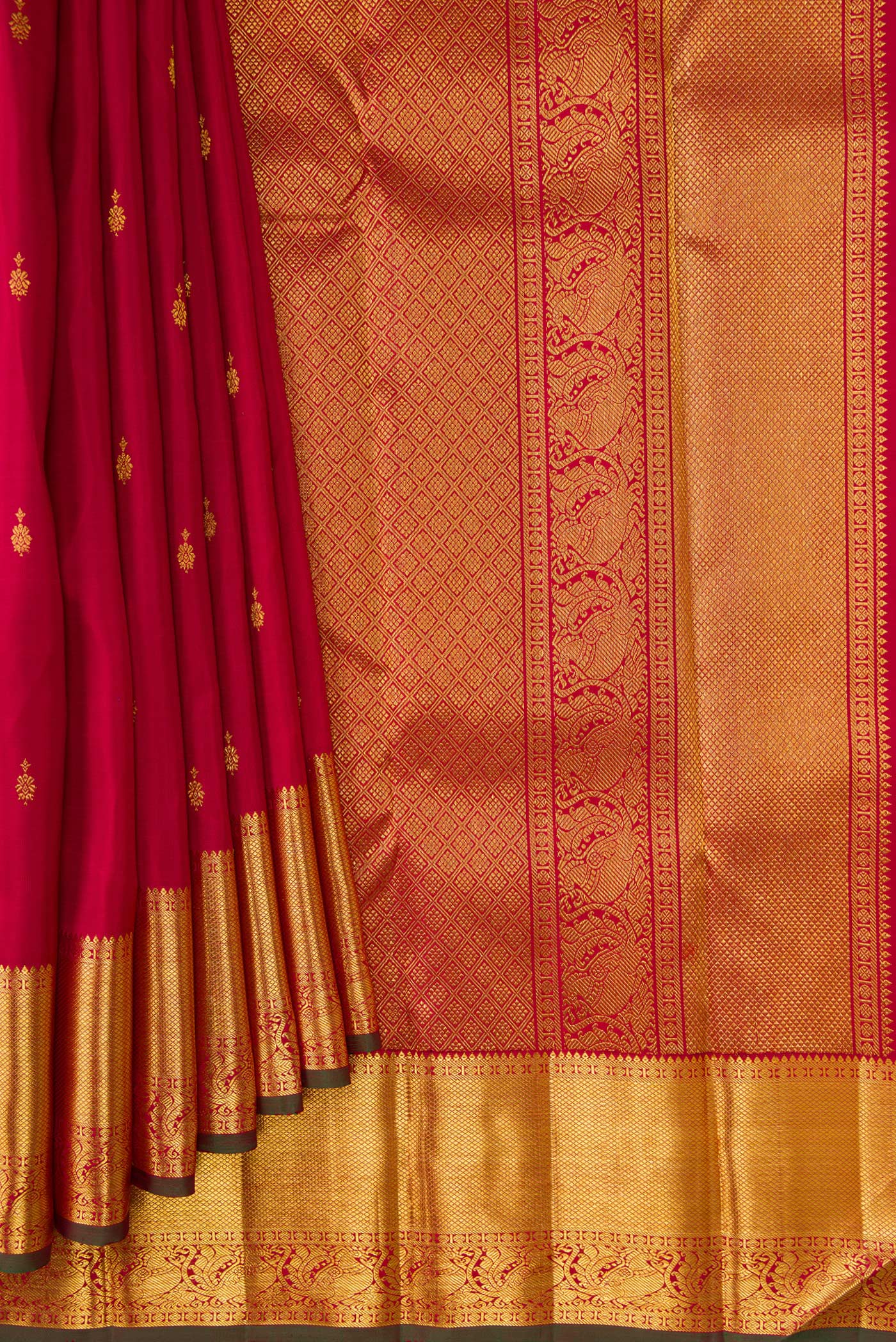 Pleats and pallu of Red Dual Tone Kanjivaram Silk Saree with Zari Butta on the body and Zari Border. 