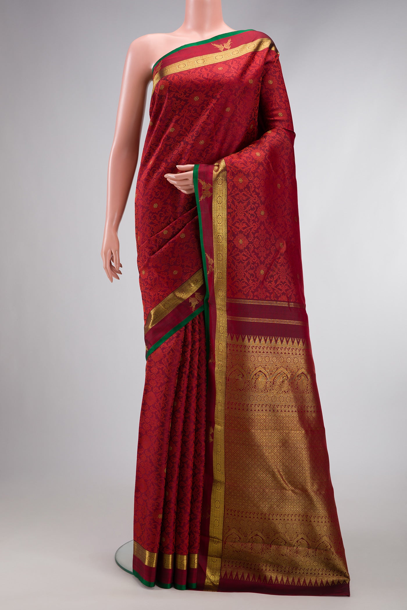 Maroon Dual Tone Kanchipuram Silk Saree with Jacquard With Zari Butta on the body and Zari Border.  displayed on a mannequin