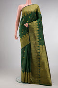 Green Dual Tone Kanchipuram Silk Saree with Zari Butta on the body and Zari Border.  displayed on a mannequin