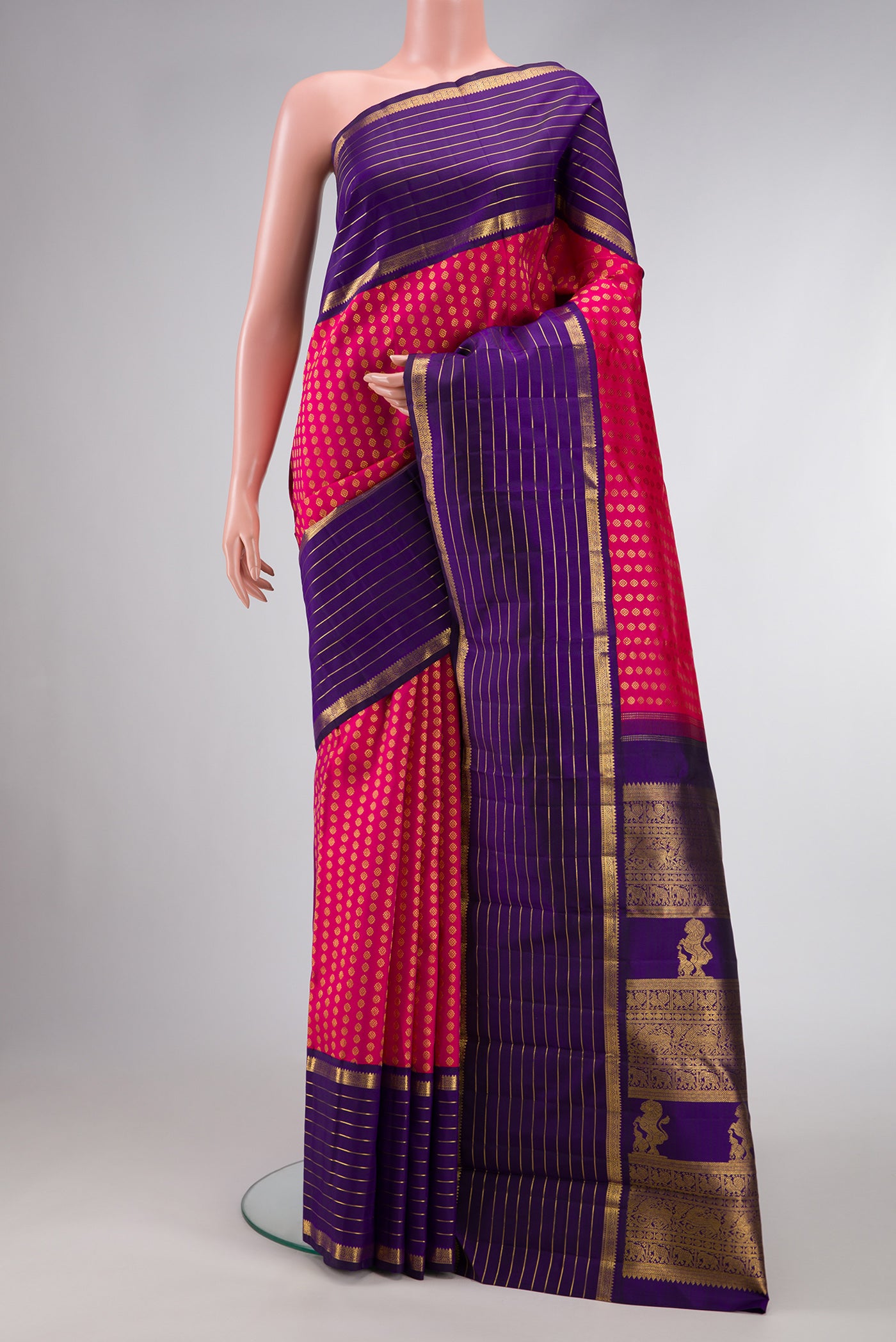 Pink Dual Tone Kanchipuram Silk Saree with Zari Butta on the body and Zari Border.  displayed on a mannequin