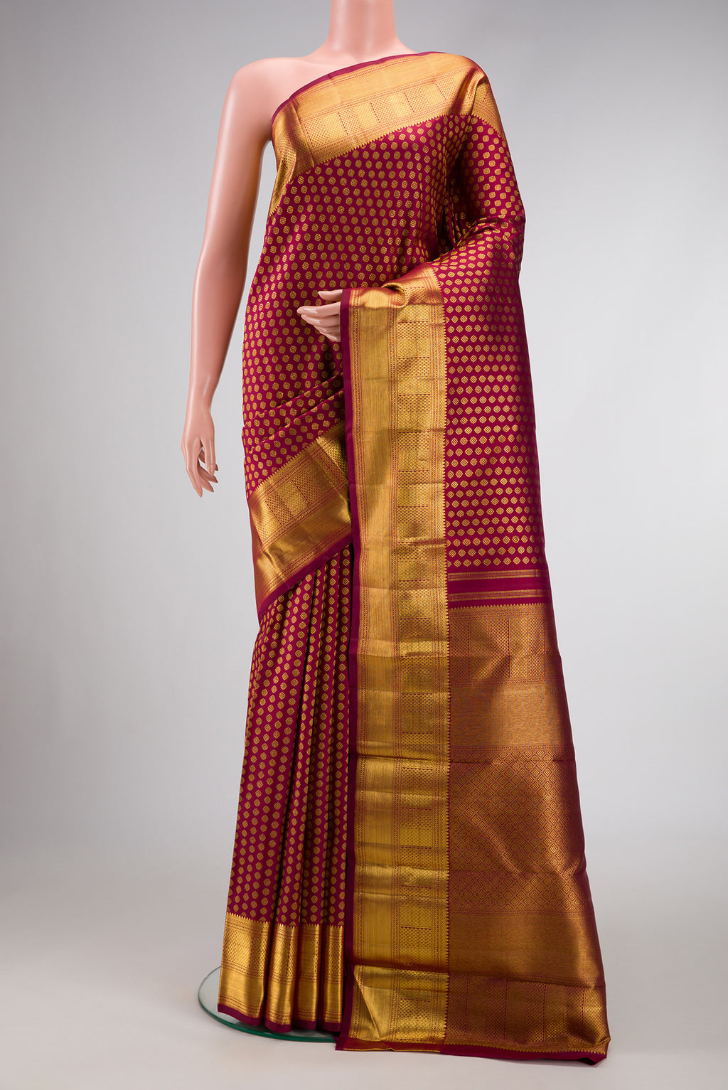 Maroon Dual Tone Kanchipuram Silk Saree with Zari Brocade on the body and Zari Border.  displayed on a mannequin