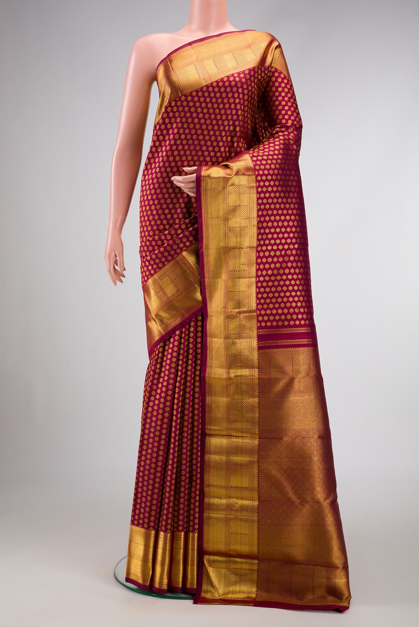 Maroon Dual Tone Kanchipuram Silk Saree with Zari Brocade on the body and Zari Border.  displayed on a mannequin