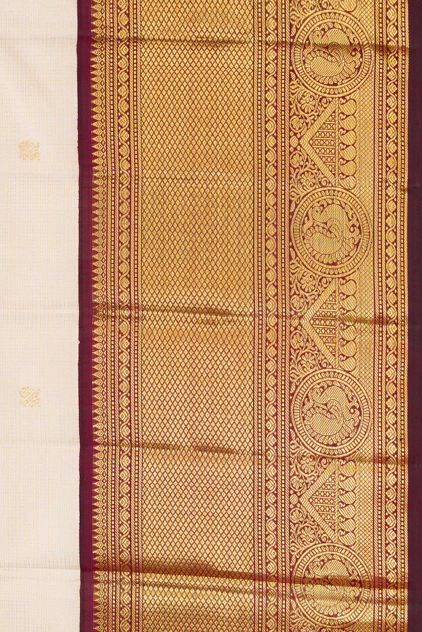 Border image of Beige Dual Tone Kanchipuram Silk Saree with Zari Butta on the body and Zari Border. 