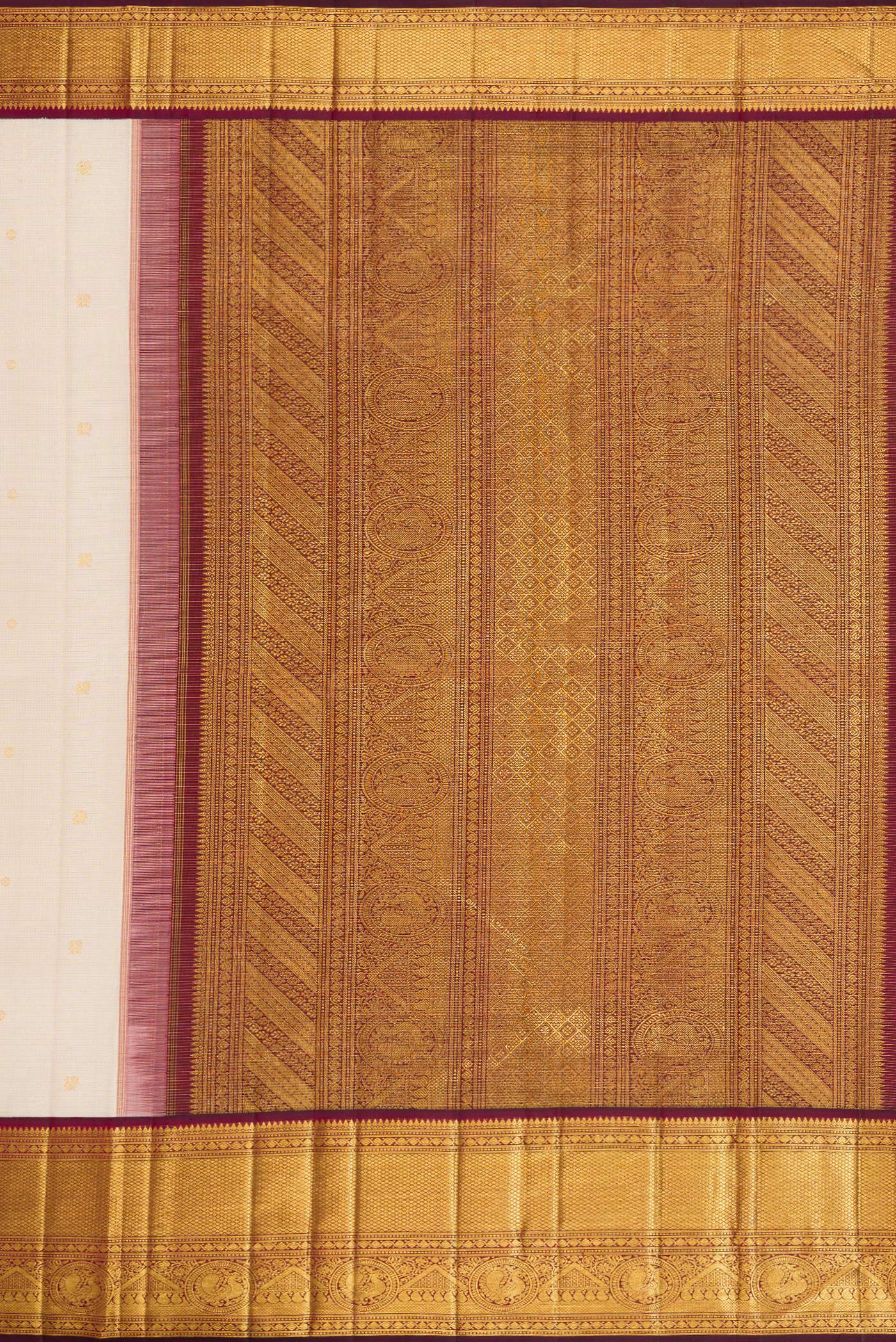 Close up image of the pallu of Beige Dual Tone Kanchipuram Silk Saree with Zari Butta on the body and Zari Border. 