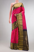 Pink Dual Tone Kanchipuram Silk Saree with Zari Butta on the body and Zari Border.  displayed on a mannequin