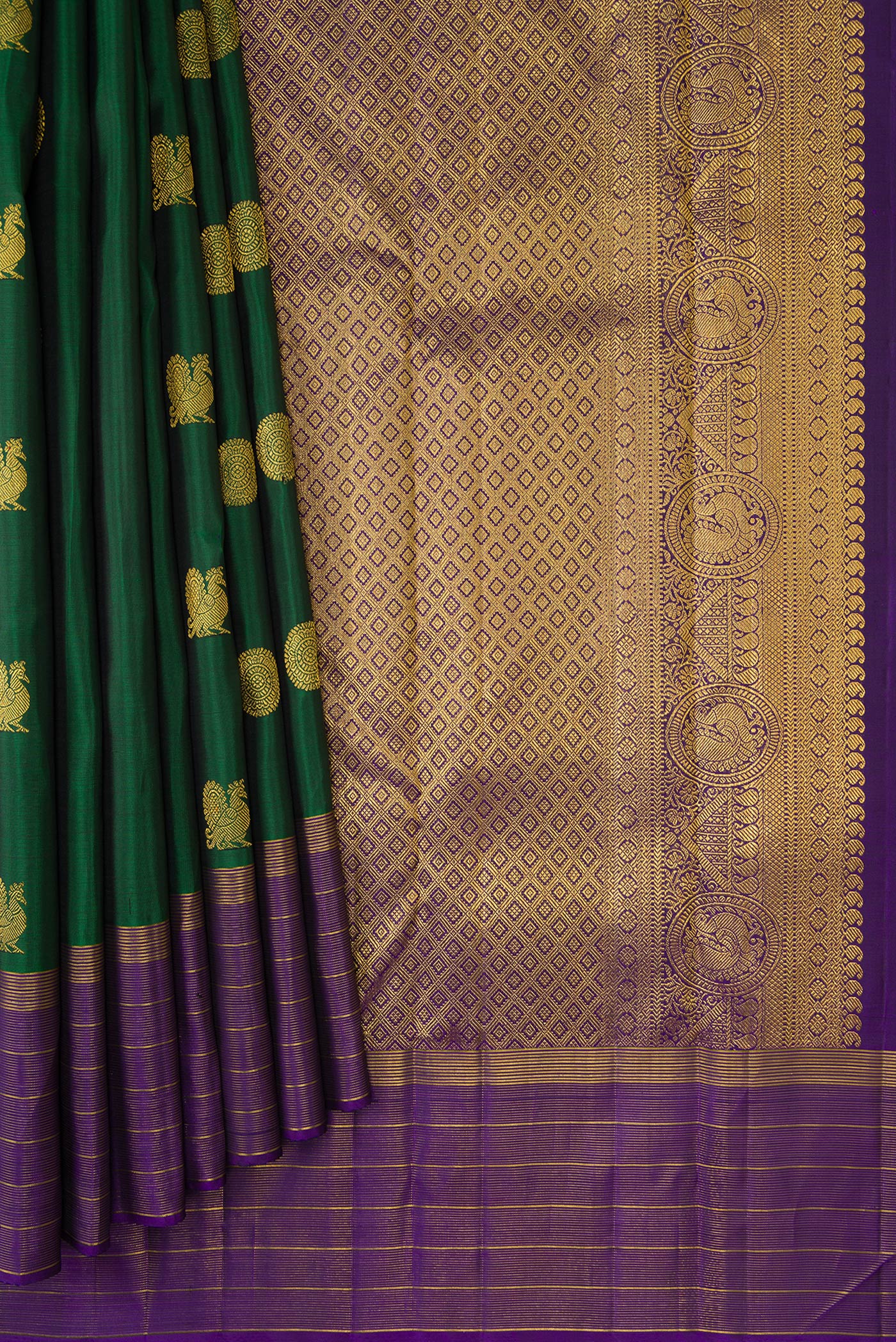 Pleats and pallu of Green Dual Tone Kanjivaram Silk Saree with Zari Butta on the body and Zari Border. 