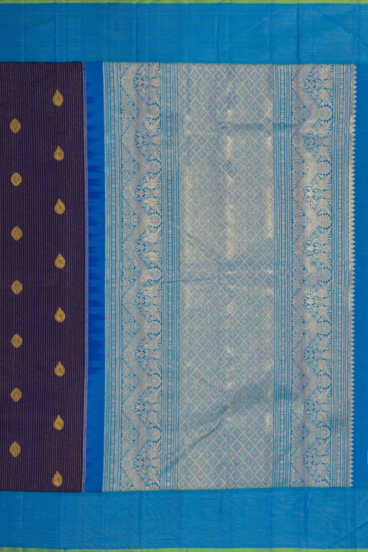 Close up image of the pallu of Navy Blue Dual Tone Kanjivaram Silk Saree with Zari Butta on the body and Zari Border. 