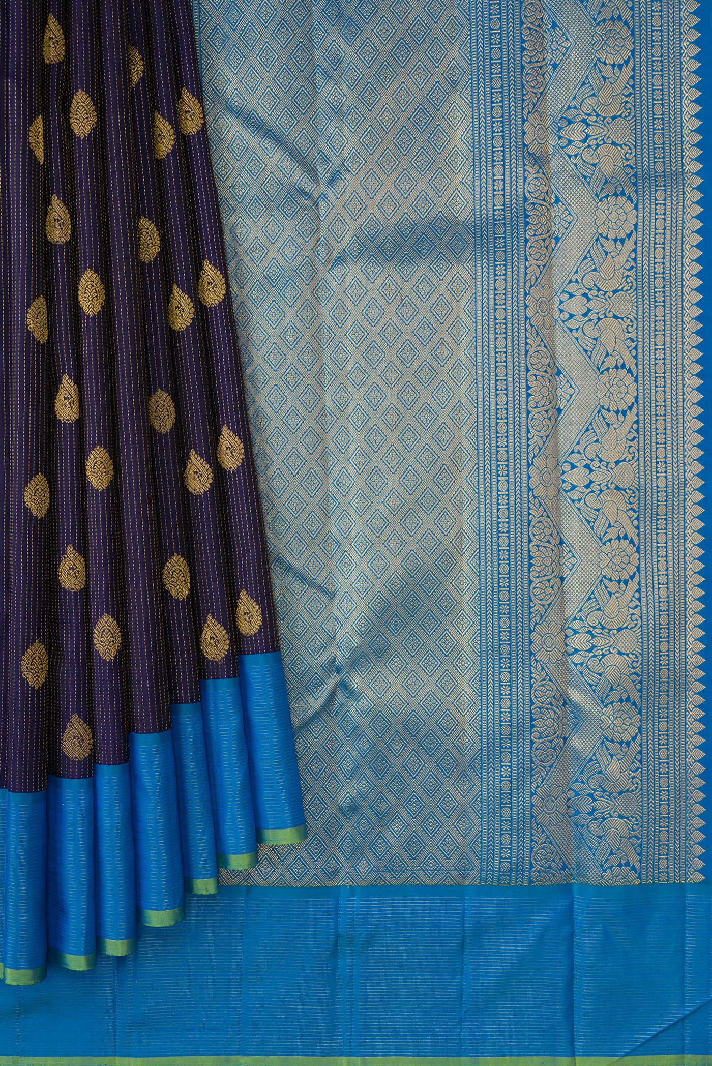 Pleats and pallu of Navy Blue Dual Tone Kanjivaram Silk Saree with Zari Butta on the body and Zari Border. 