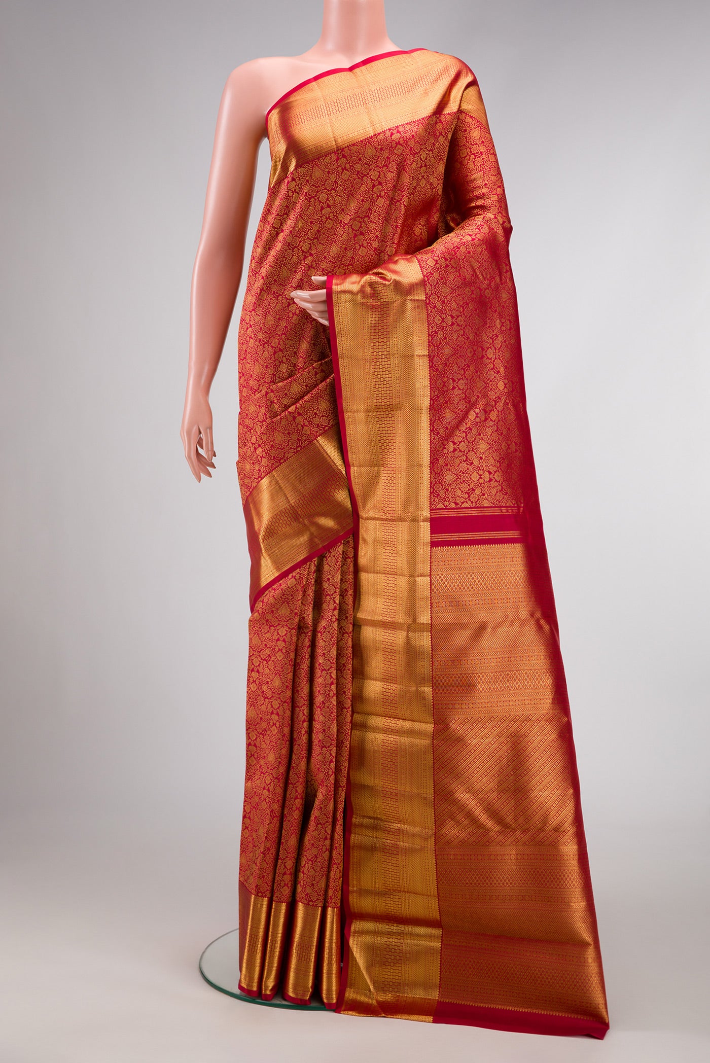 Dark Pink Dual Tone Kanchipuram Silk Saree with Zari Brocade on the body and Zari Border.  displayed on a mannequin