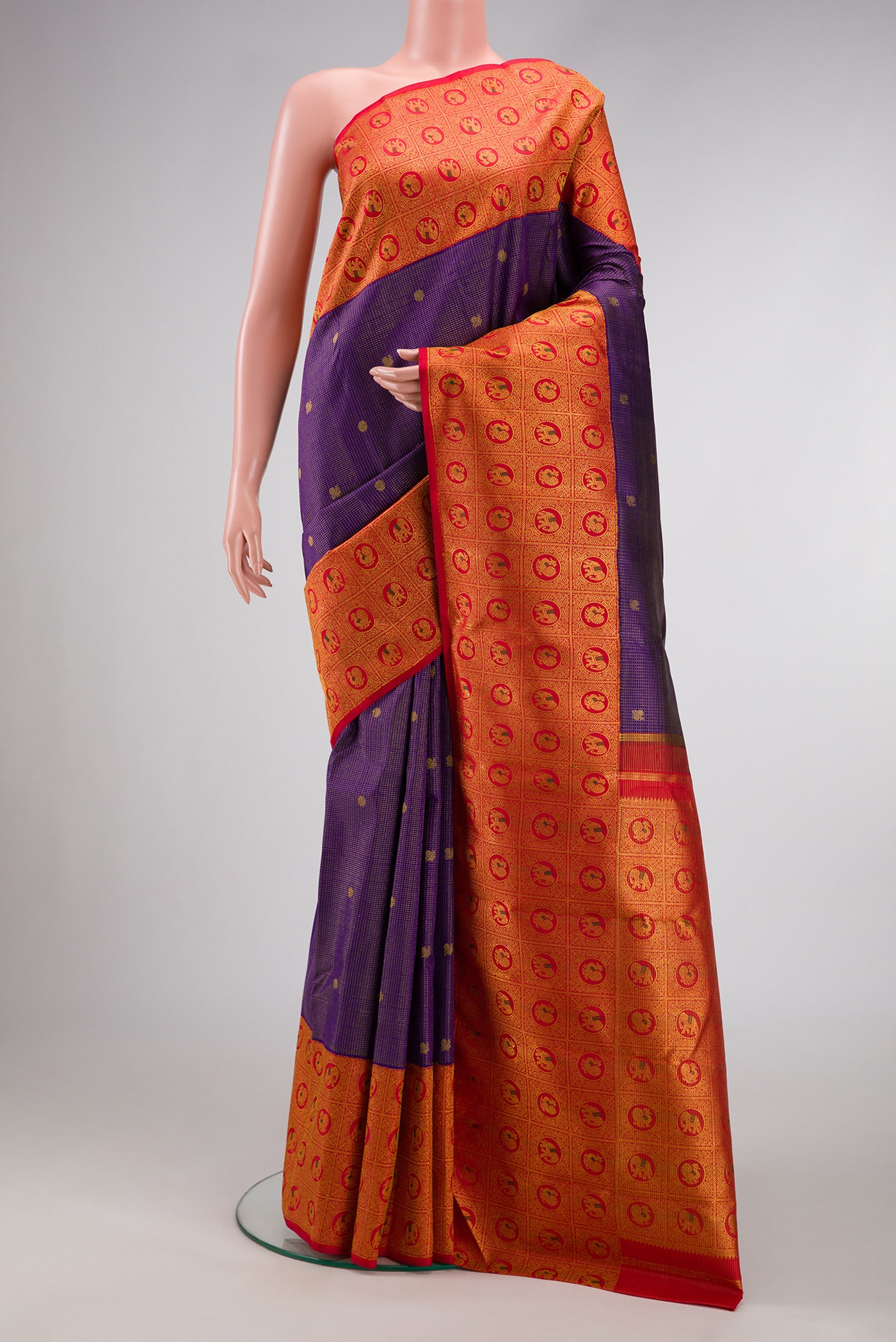 Violet Dual Tone Kanchipuram Silk Saree with Zari Butta on the body and Zari Border.  displayed on a mannequin