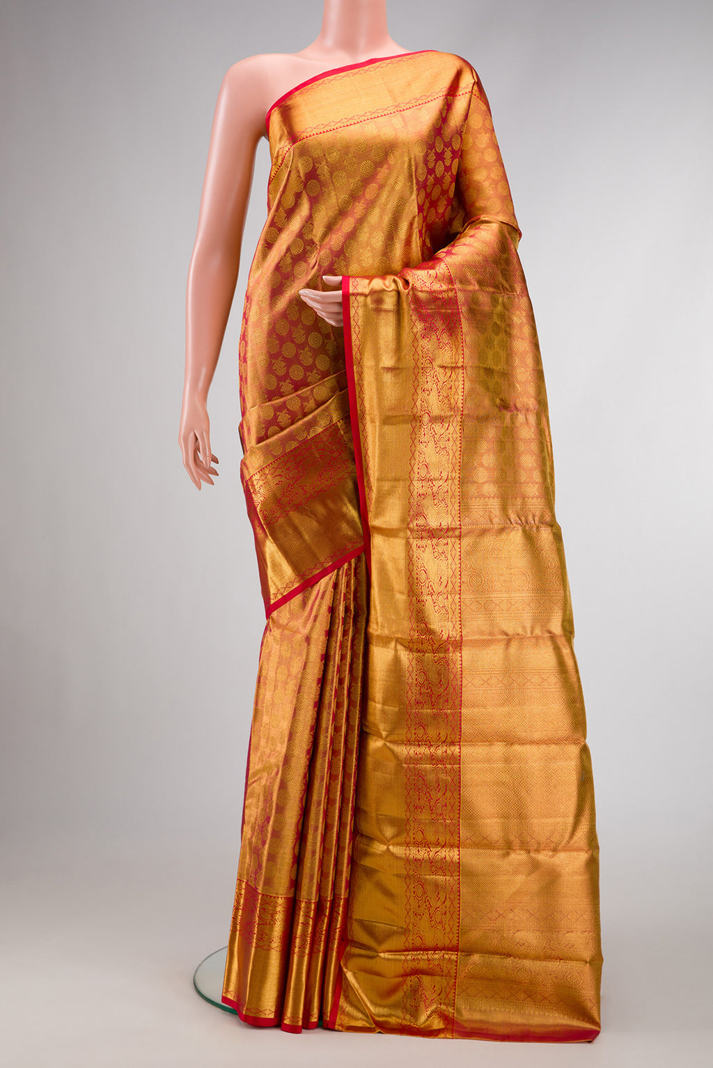 Dark Pink Dual Tone Kanchipuram Tissue Silk Saree with Zari Brocade on the body and Zari Border.  displayed on a mannequin