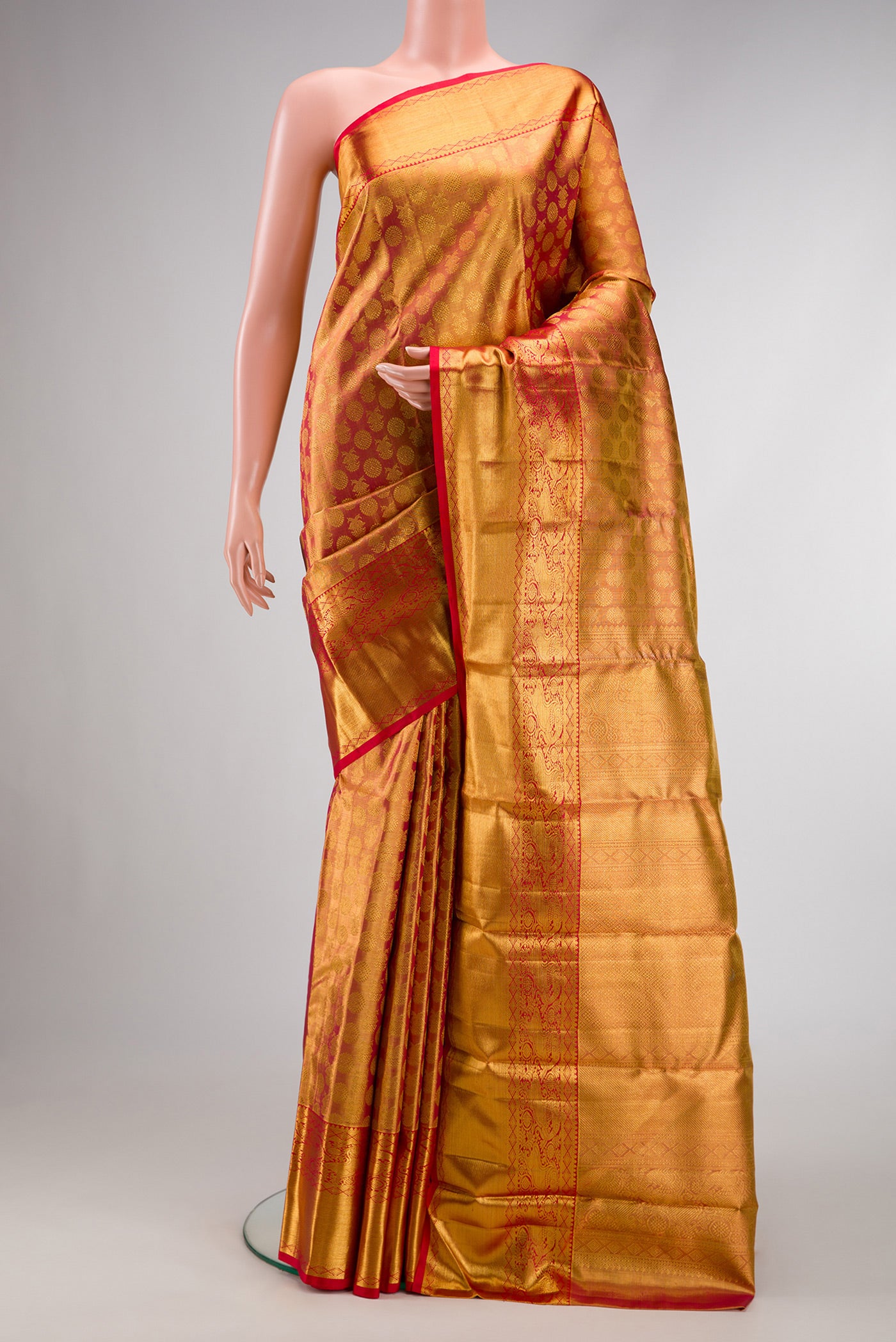 Dark Pink Dual Tone Kanchipuram Tissue Silk Saree with Zari Brocade on the body and Zari Border.  displayed on a mannequin