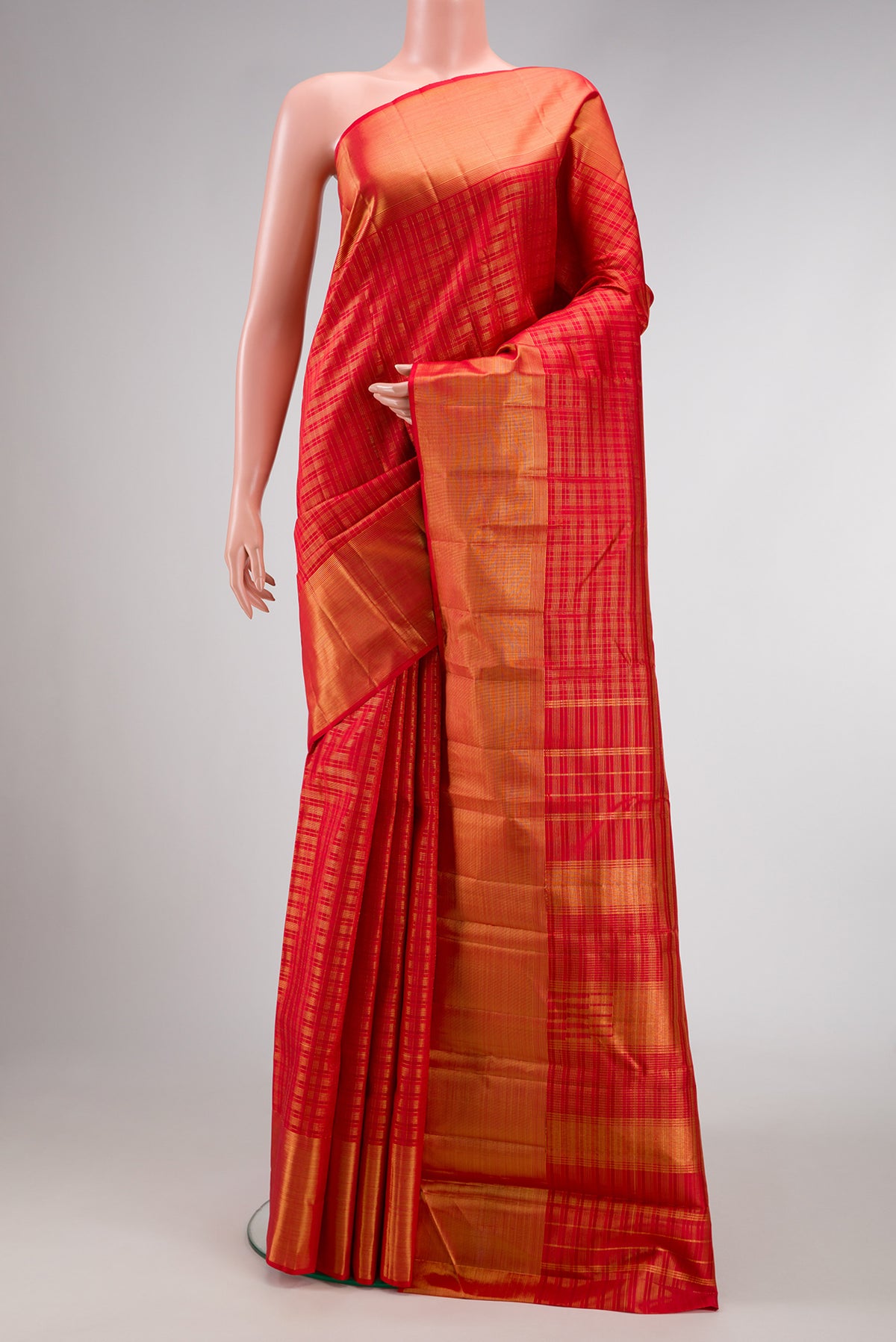 Red Dual Tone Kanjivaram Silk Saree with Checked design on the body and Zari Border.  displayed on a mannequin