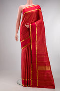 Pure Silk Deep Red Kanjivaram Saree with Checked design on the body and Zari Border.  displayed on a mannequin
