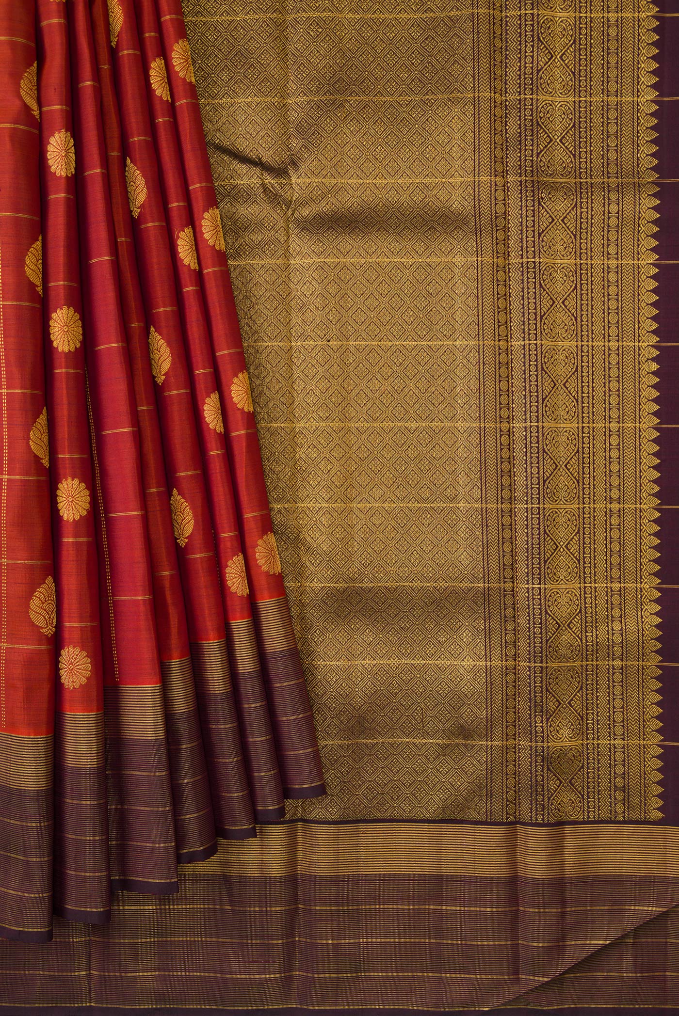 Pleats and pallu of Brick Orange Dual Tone Kanjivaram Silk Saree with Checked design on the body and Zari Border. 
