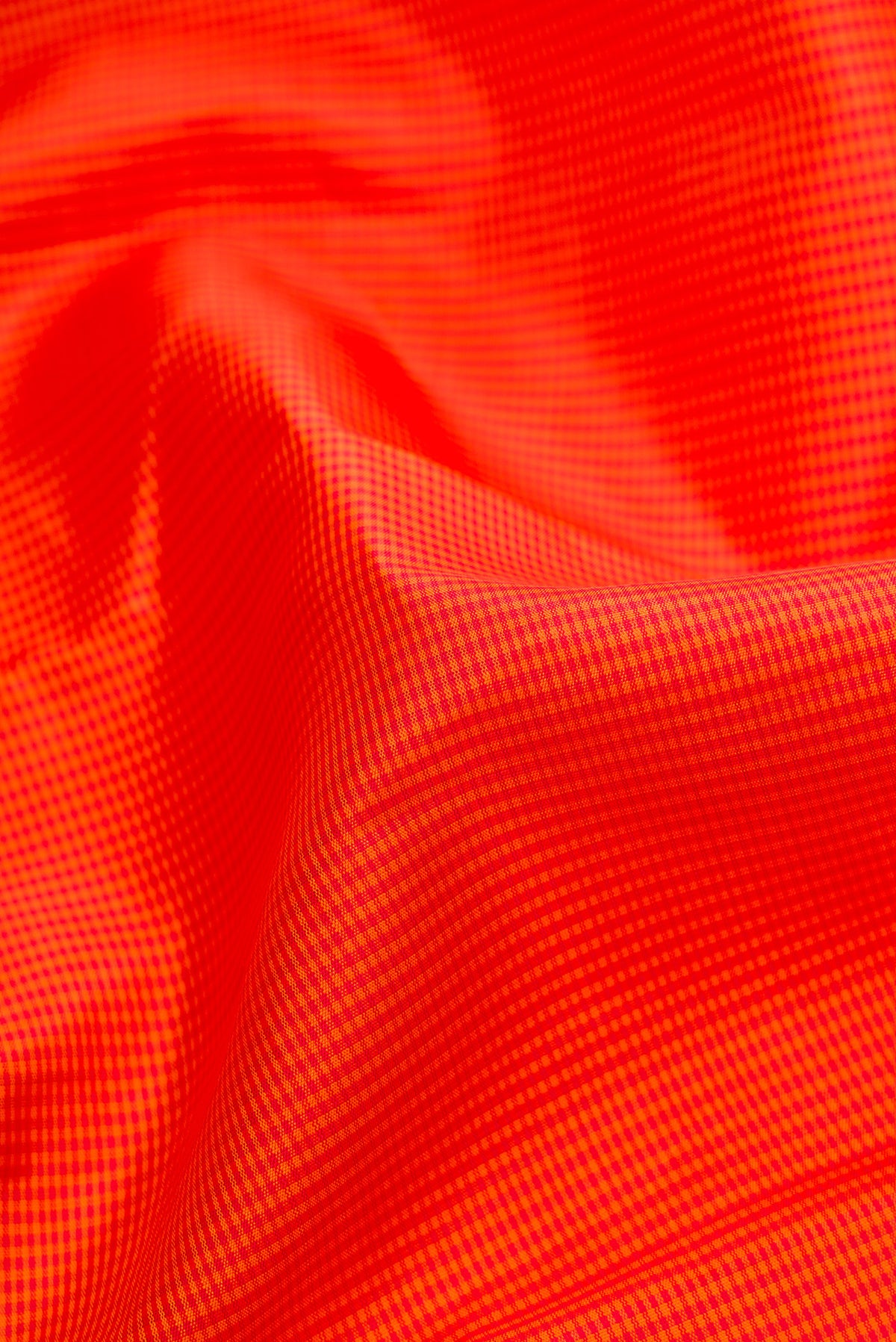 Close up of Pure Silk Pure Zari Orange Dual Tone Kanjivaram Saree with Checked design on the body and Zari Border.  displaying folds