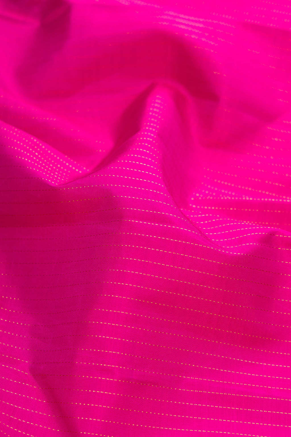 Close up of Purple Dual Tone Kanjivaram Silk Saree with Stripes on the body and Zari Border.  displaying folds