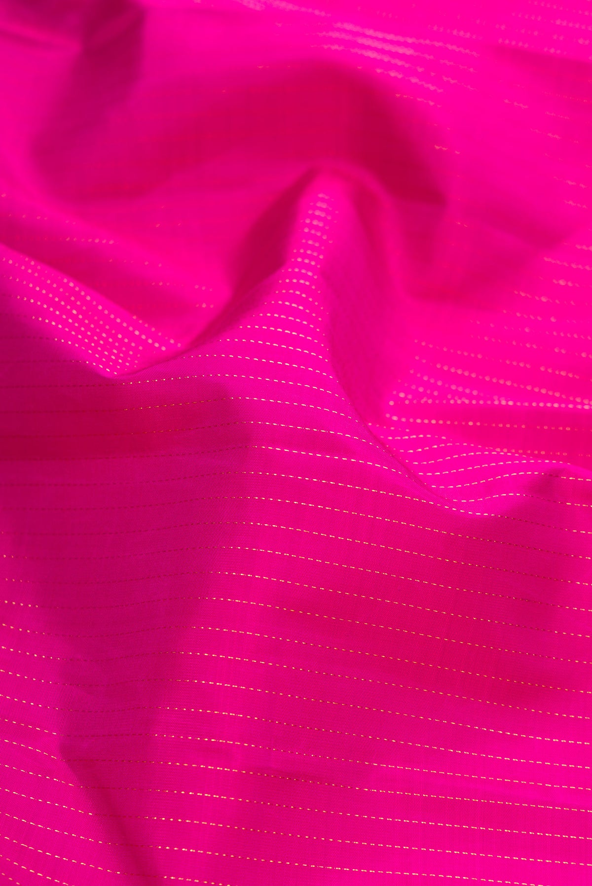 Close up of Purple Dual Tone Kanjivaram Silk Saree with Stripes on the body and Zari Border.  displaying folds