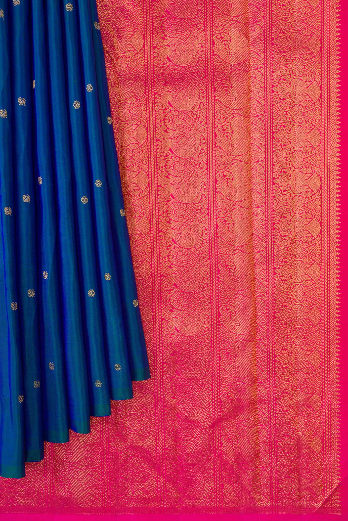 Pleats and pallu of Peacock Blue Dual Tone Kanjivaram Silk Saree with Zari Butta on the body and Without Border. 