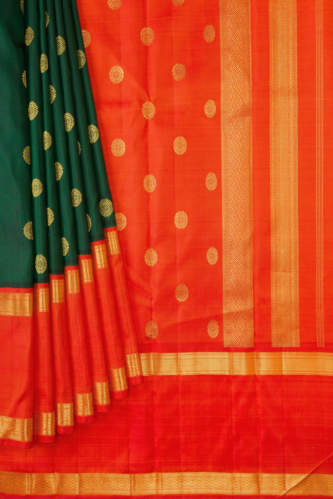Pleats and pallu of Bottle Green Dual Tone Kanchipuram Silk Saree with Zari Butta on the body and Zari Border. 