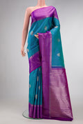Peacock Blue Dual Tone Kanjivaram Silk Saree with Zari Butta on the body and Zari Border.  displayed on a mannequin