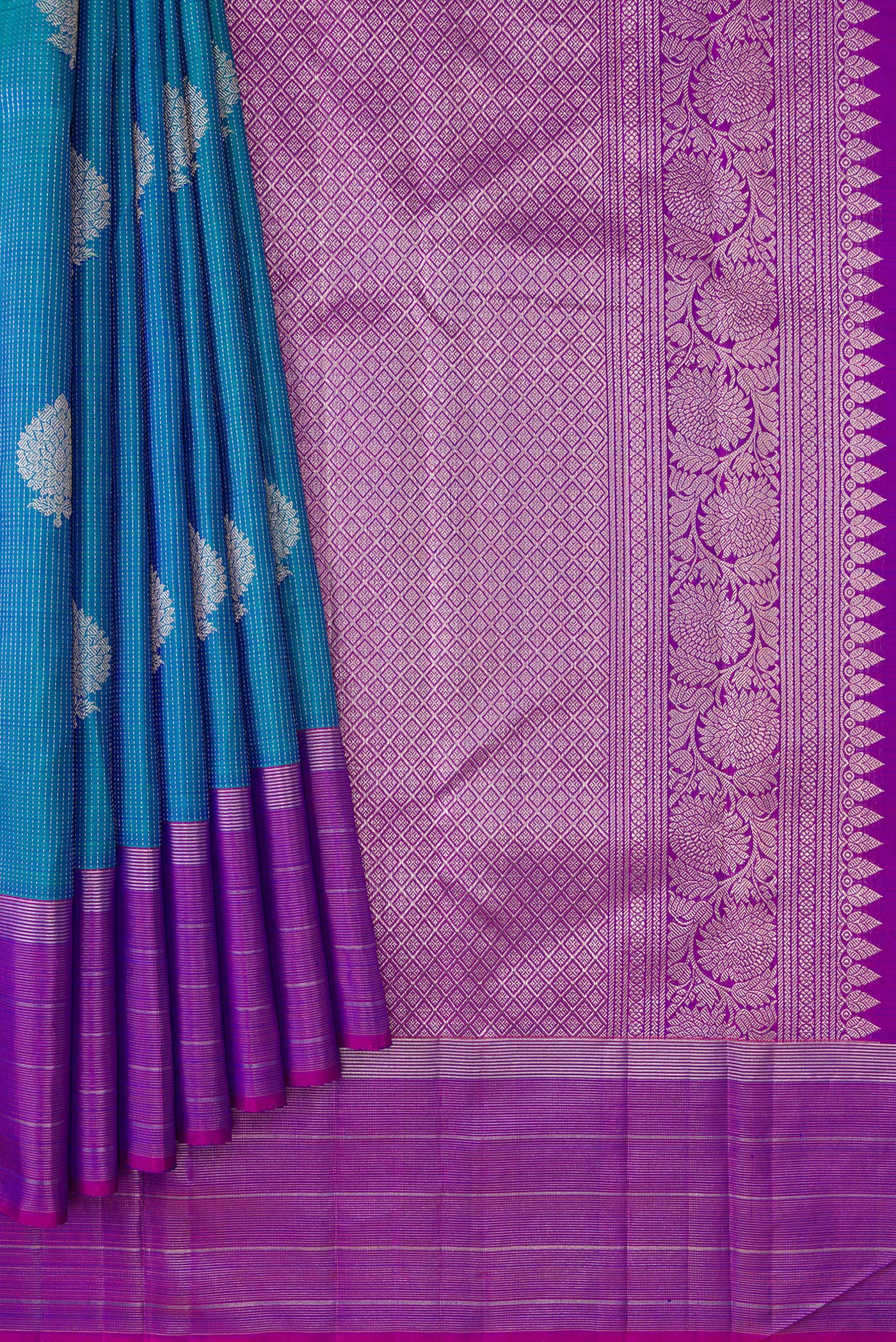Pleats and pallu of Peacock Blue Dual Tone Kanjivaram Silk Saree with Zari Butta on the body and Zari Border. 