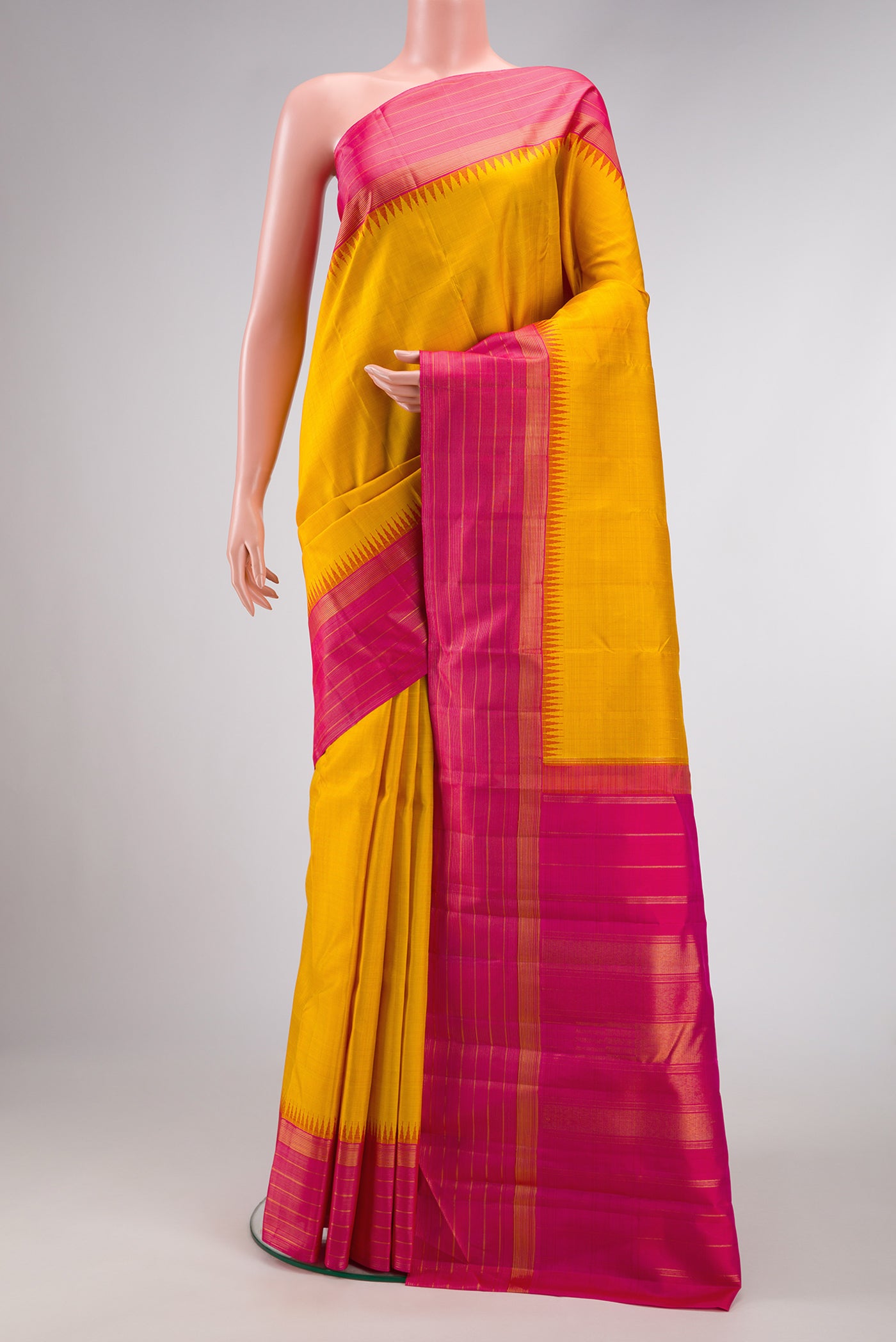Yellow Dual Tone Kanjivaram Silk Saree with Checked design on the body and Zari Border.  displayed on a mannequin