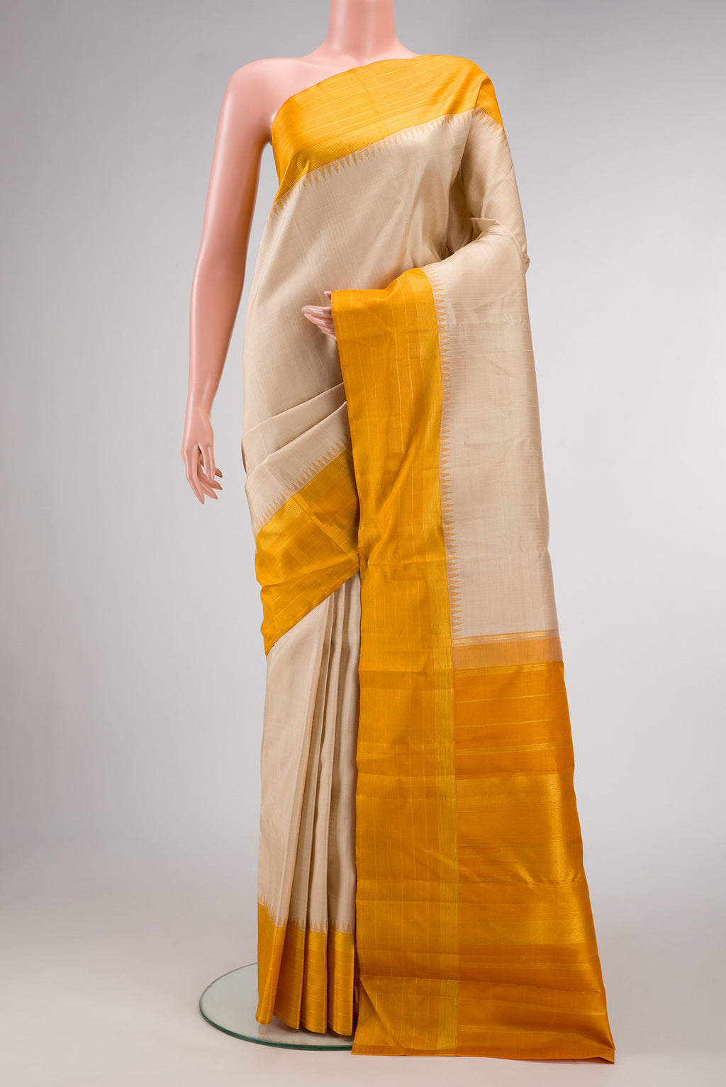 Beige Dual Tone Kanjivaram Silk Saree with Checked design on the body and Zari Border.  displayed on a mannequin