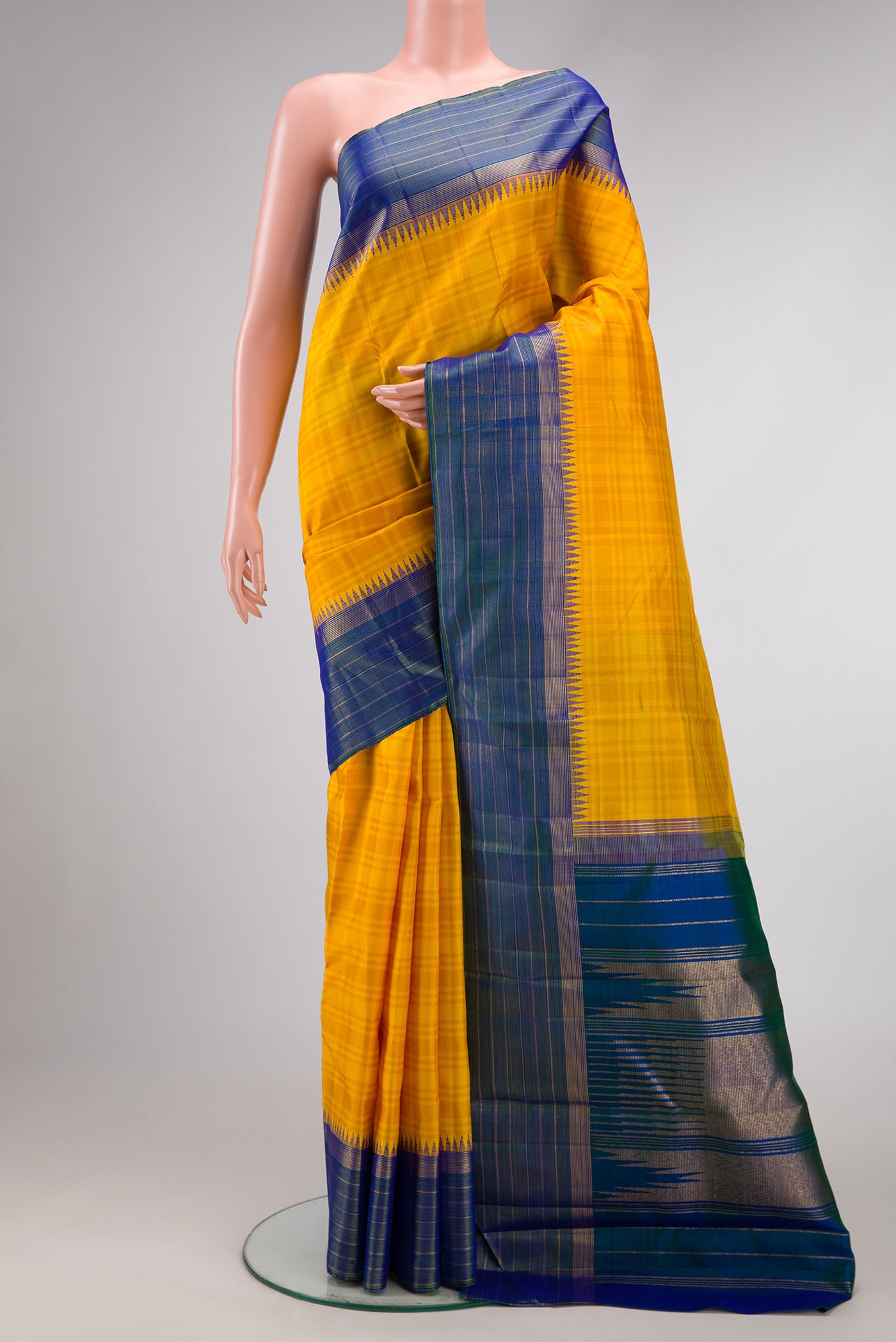 Yellow Dual Tone Kanjivaram Silk Saree with Stripes on the body and Zari Border.  displayed on a mannequin