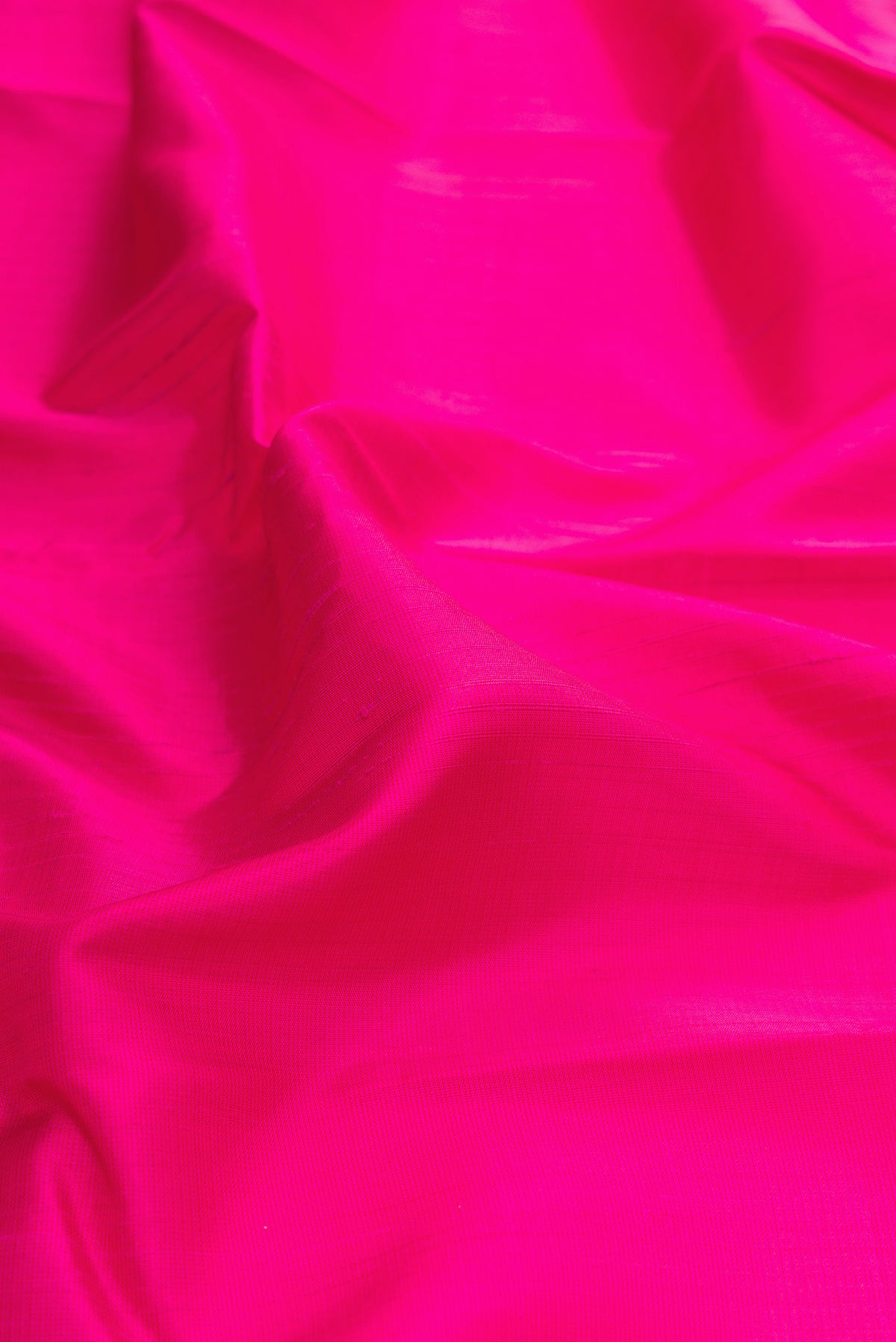 Close up of Pink Dual Tone Kanjivaram Silk Saree with Plain Body and Temple Border.  displaying folds