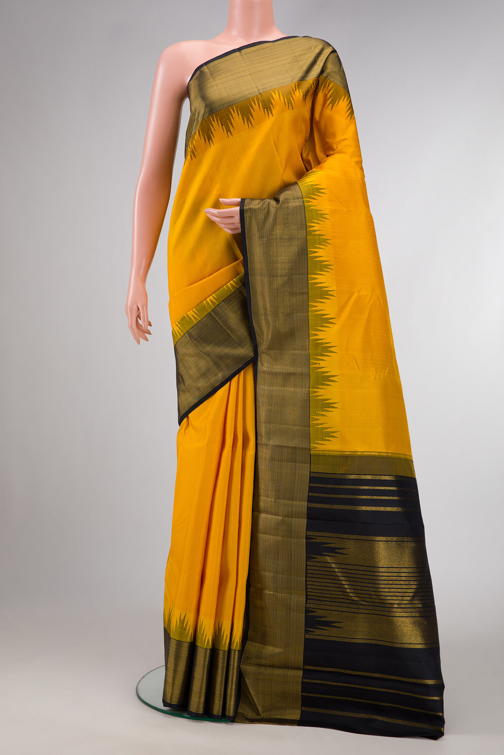 Mustard Dual Tone Kanjivaram Silk Saree with Plain Body and Temple Border.  displayed on a mannequin