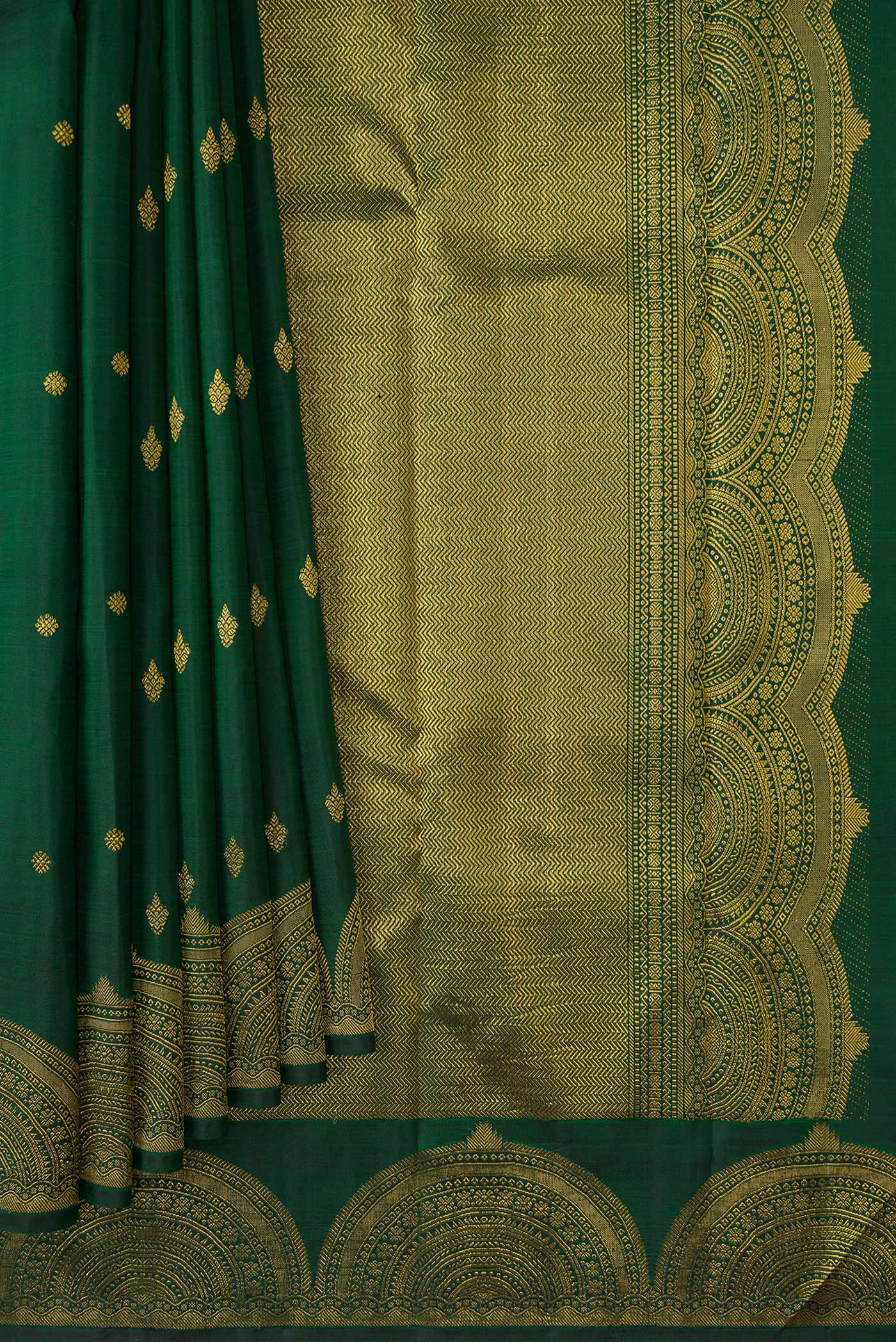 Pleats and pallu of Green Dual Tone Kanjivaram Silk Saree with Zari Butta on the body and Fancy Border. 