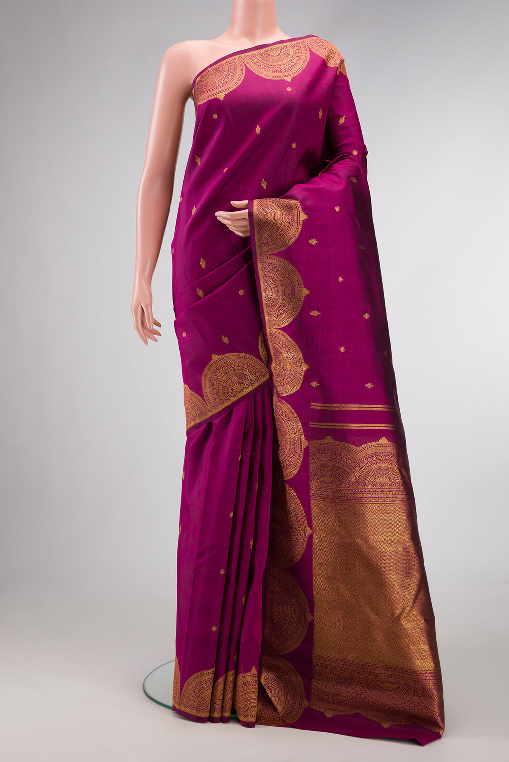 Magenta Dual Tone Kanjivaram Silk Saree with Zari Butta on the body and Fancy Border.  displayed on a mannequin