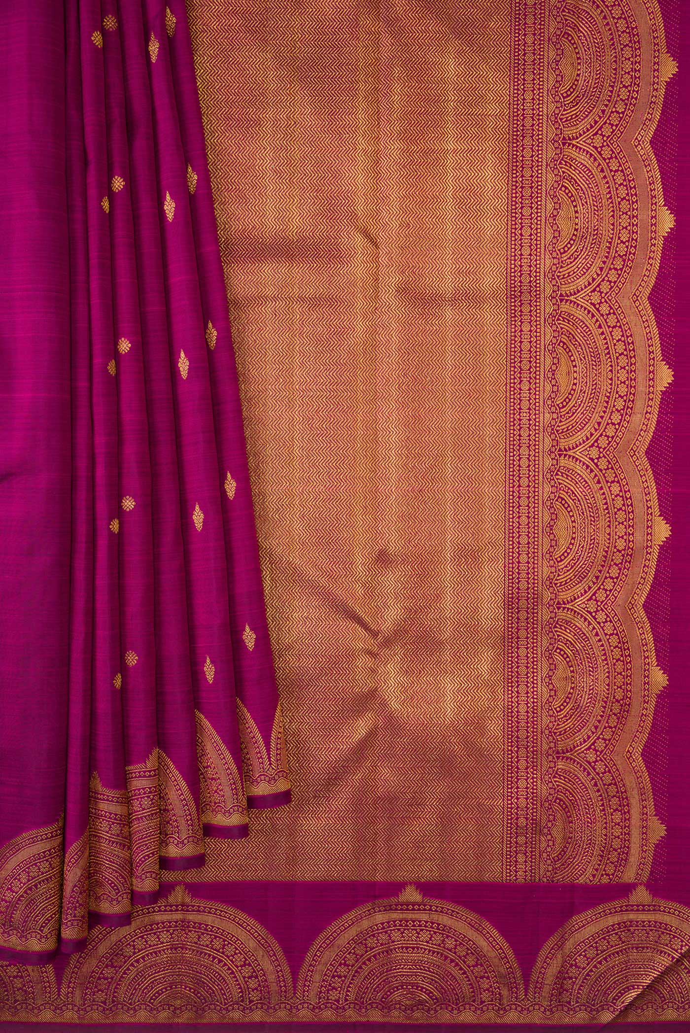 Pleats and pallu of Magenta Dual Tone Kanjivaram Silk Saree with Zari Butta on the body and Fancy Border. 