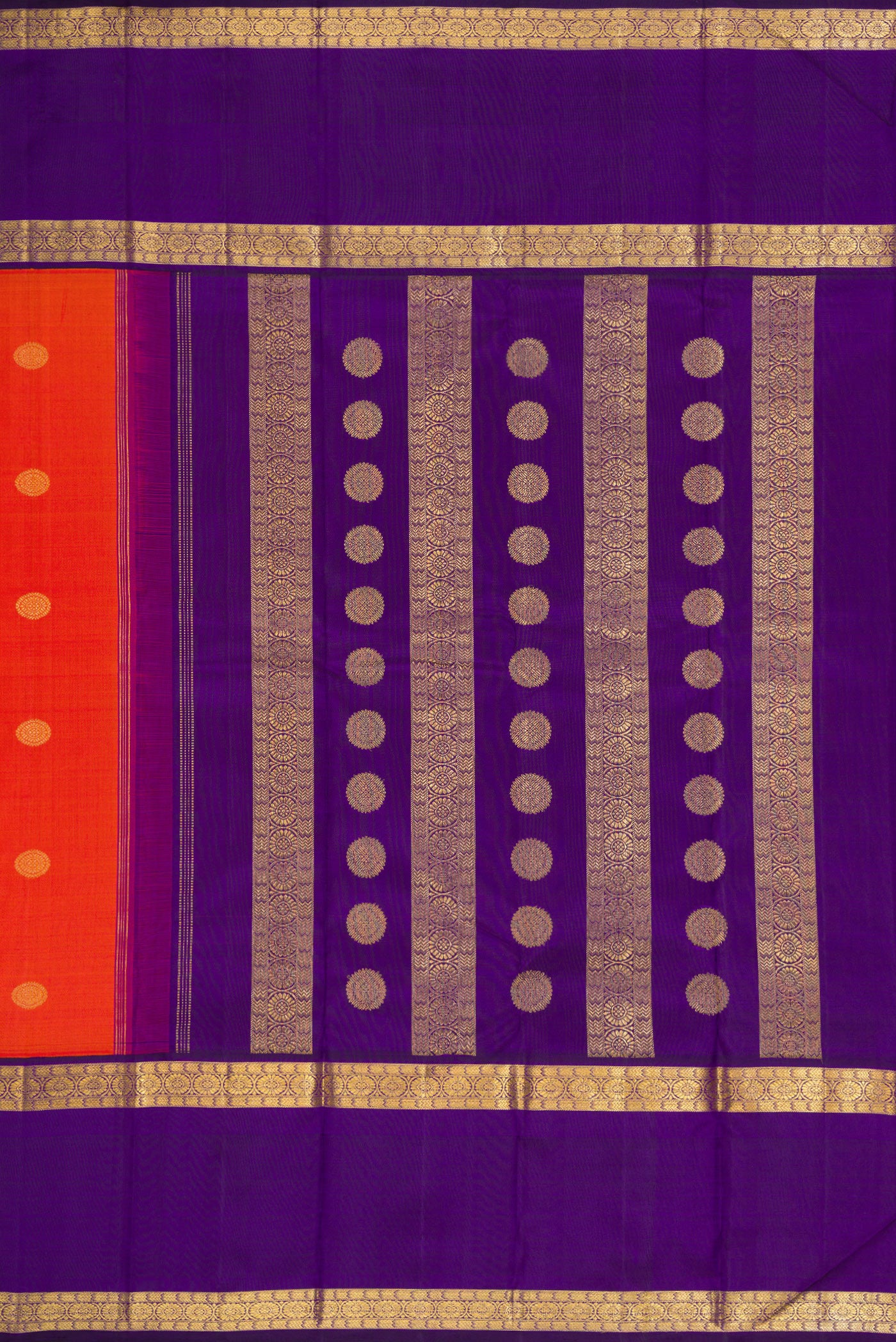 Close up image of the pallu of Orange Dual Tone Kanjivaram Silk Saree with Zari Butta on the body and Zari Border. 