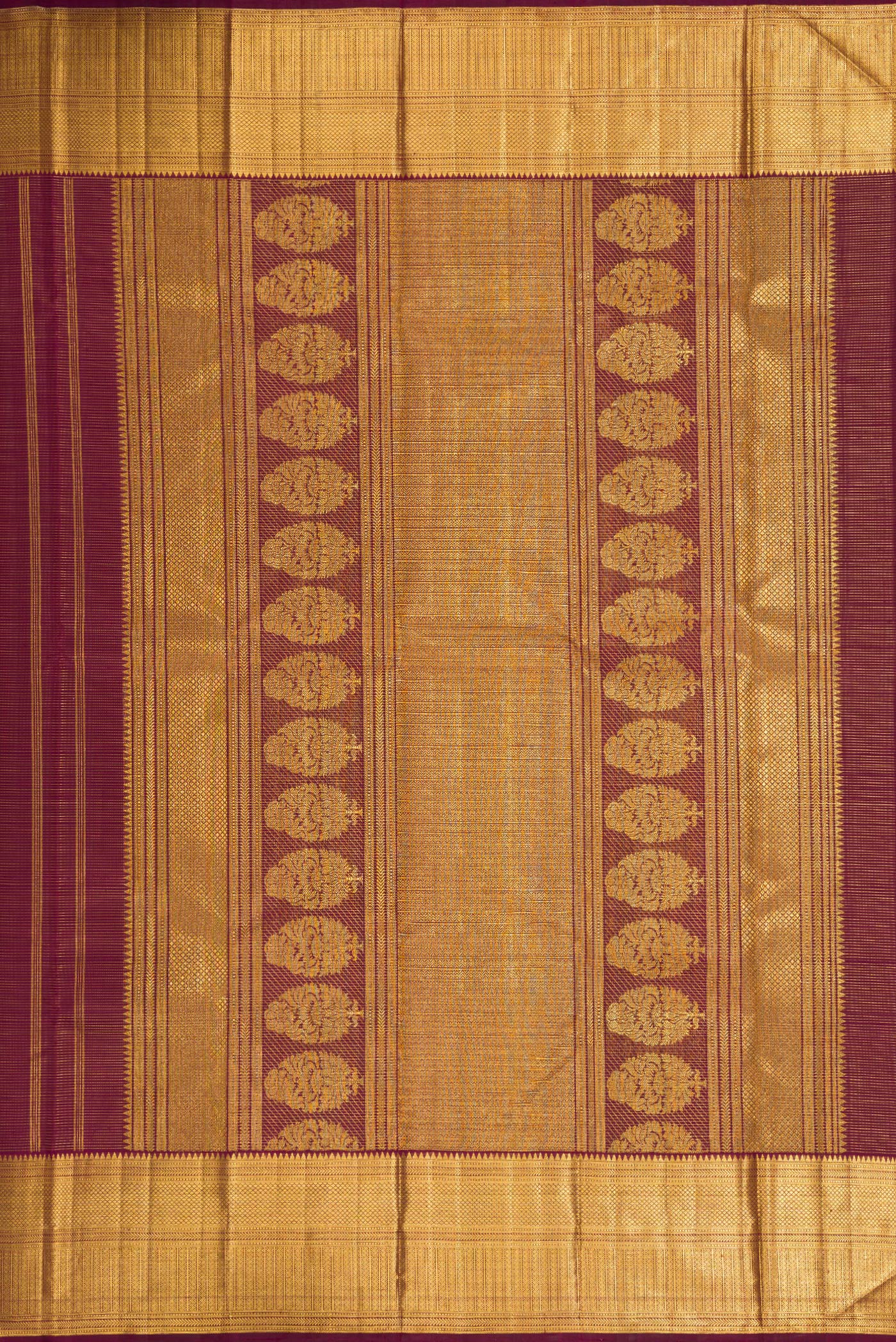 Close up image of the pallu of Burgundy Dual Tone Kanjivaram Silk Saree with Stripes on the body and Zari Border. 