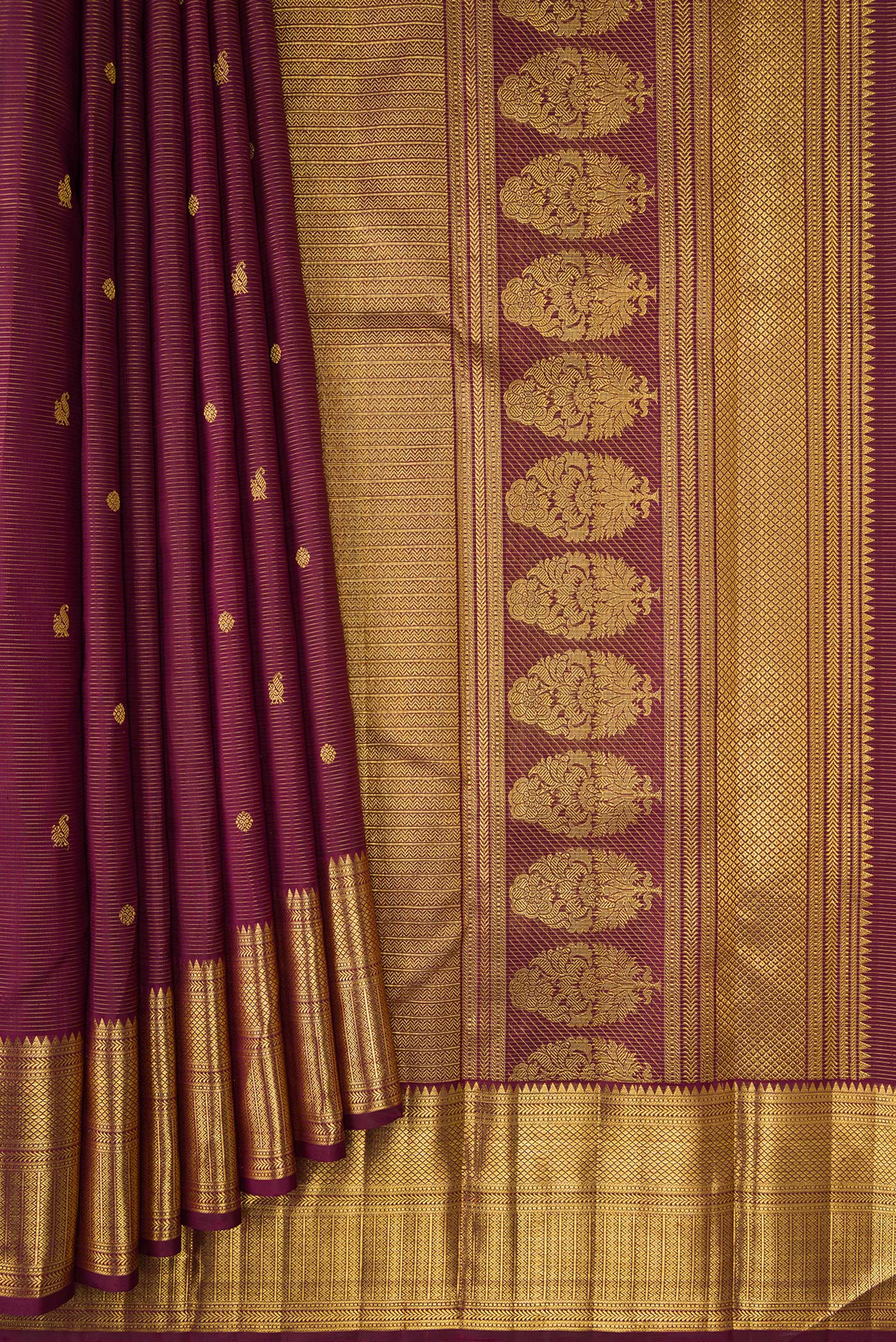 Pleats and pallu of Burgundy Dual Tone Kanjivaram Silk Saree with Stripes on the body and Zari Border. 